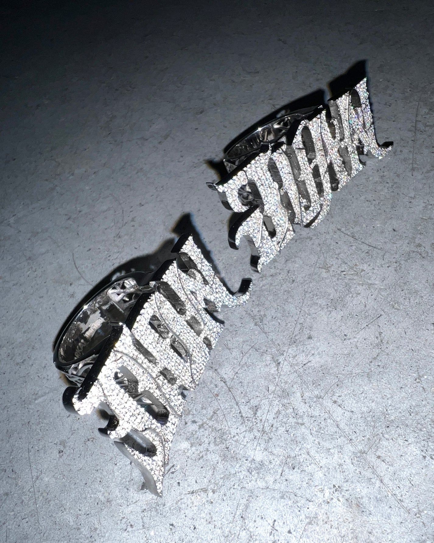 DARKAI Don Juan rings shot with flash on grey background