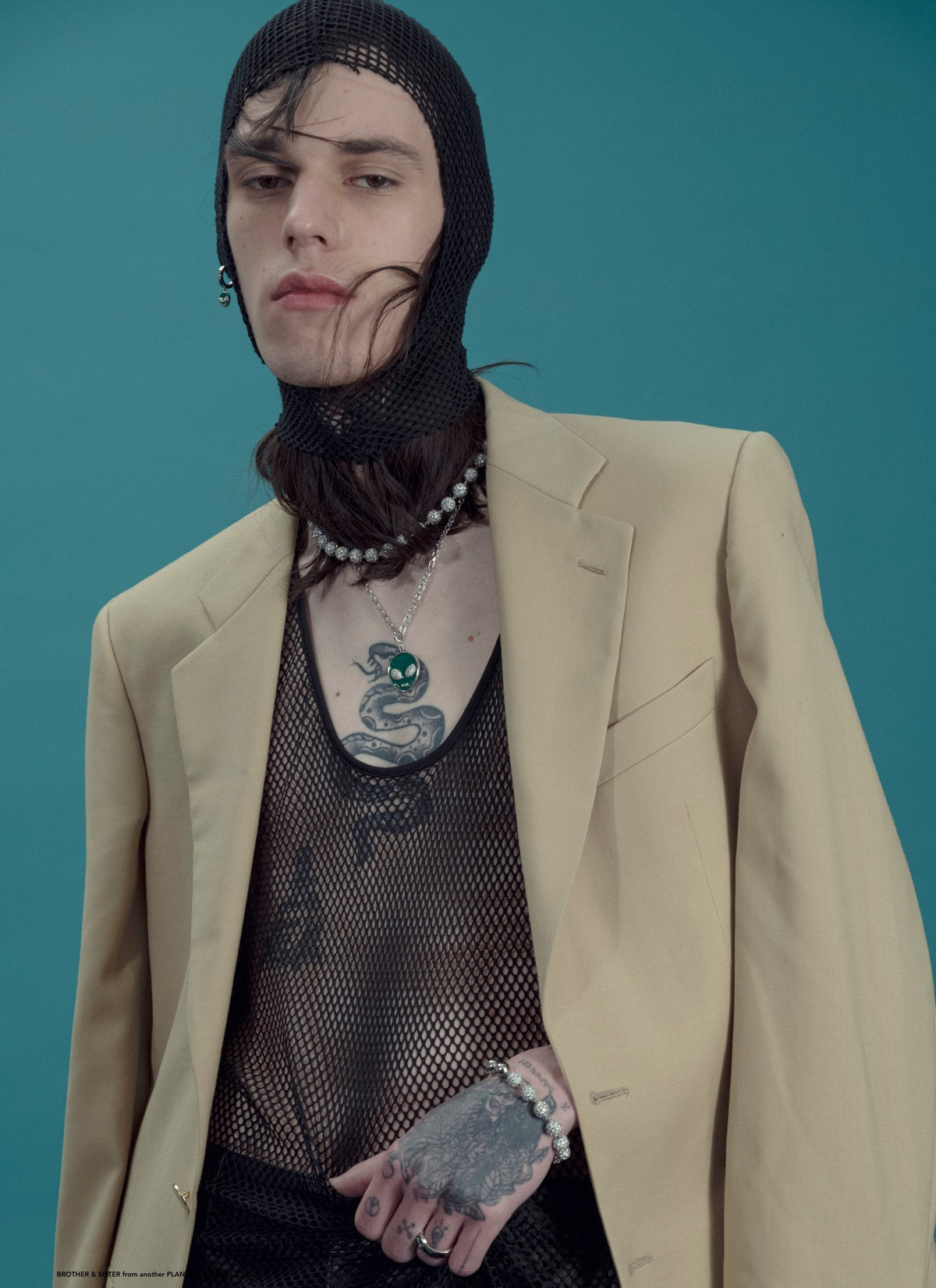 DARKAI Outer World Lookbook SS23 Man wearing alien pendant