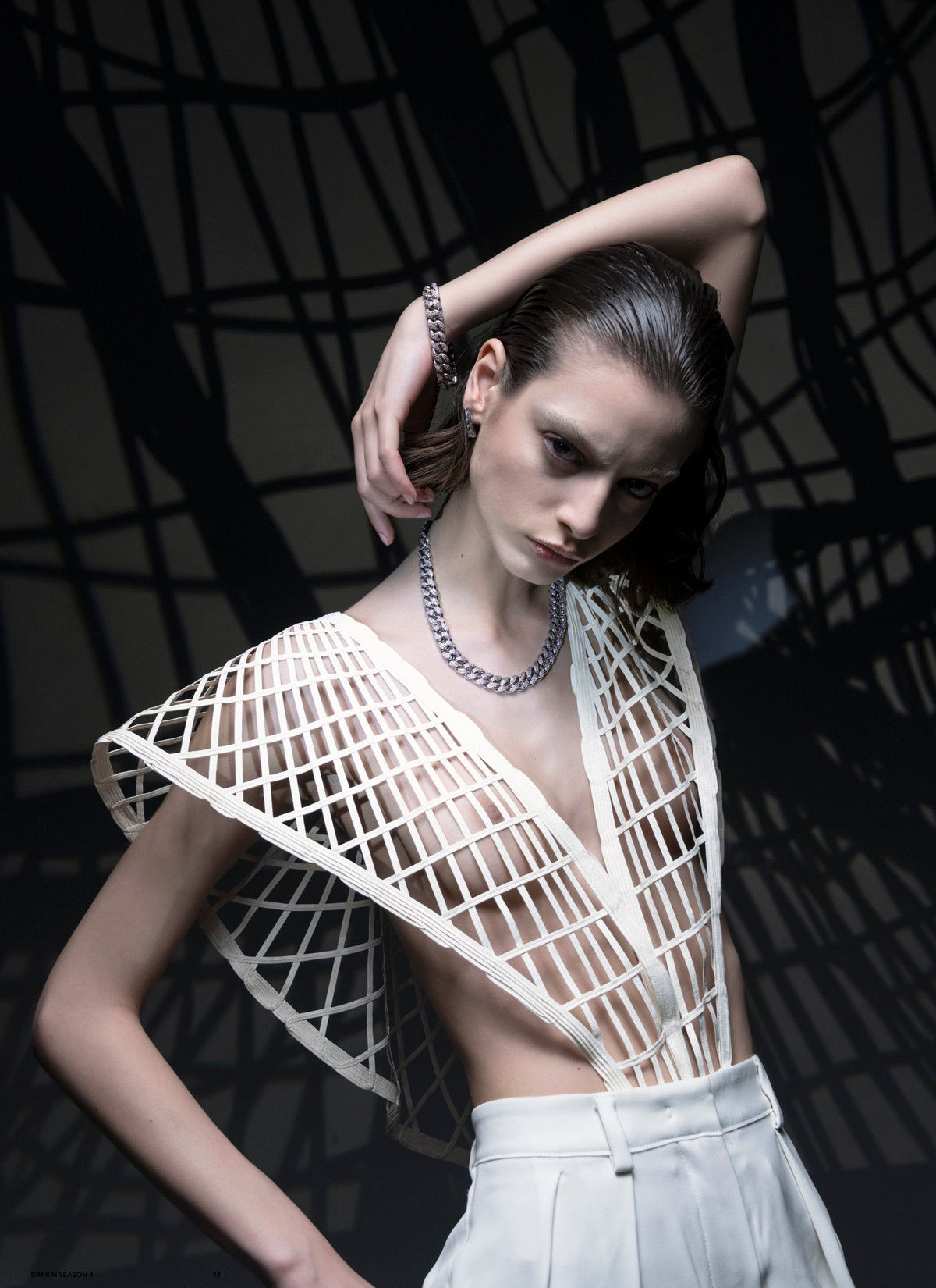 DARKAI Outer World Lookbook SS23 Woman wearing cuban chain necklace with diamonds