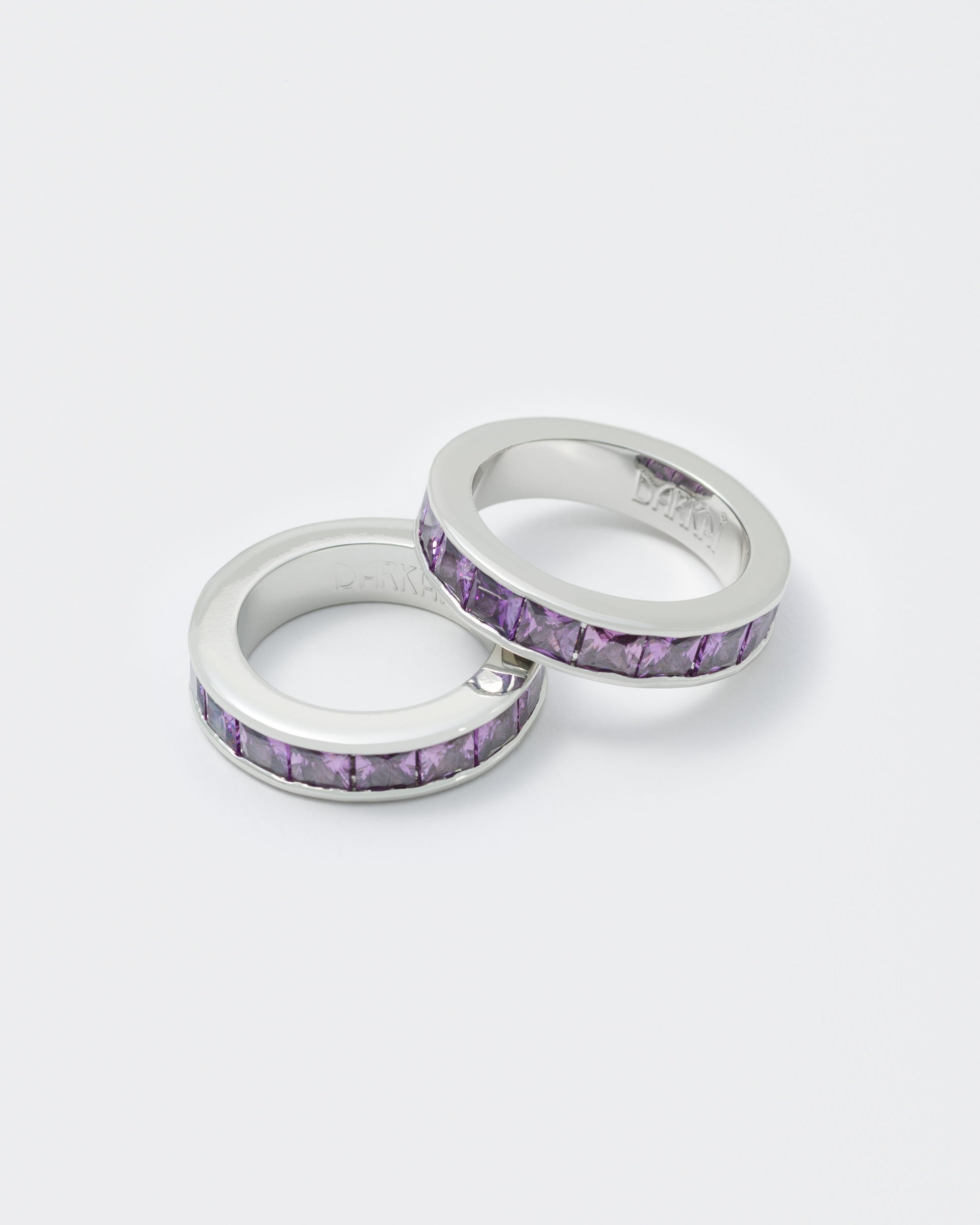 detail of white ring with purple stones