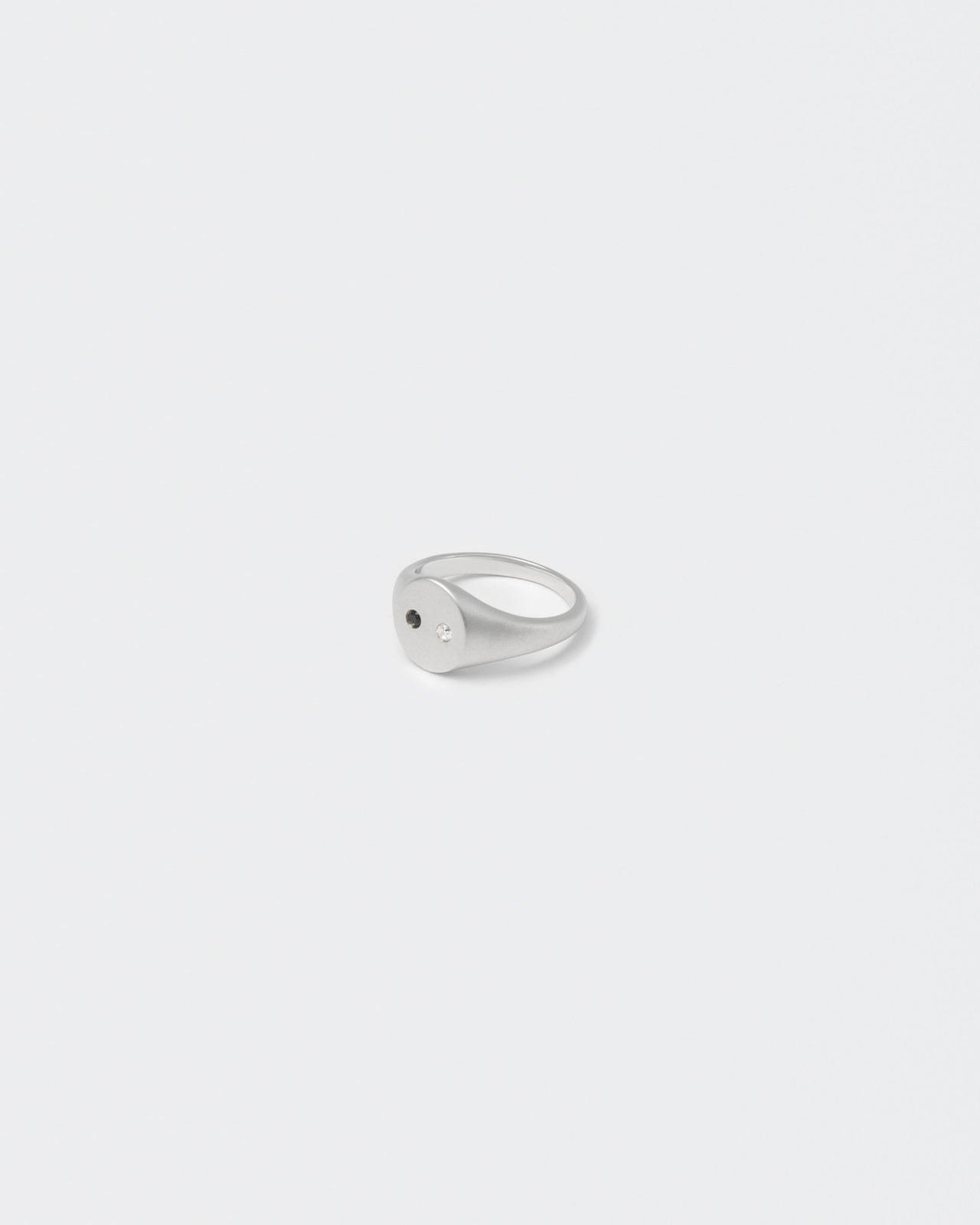 white gold satined ring with hand-set stones in white and black for man and women