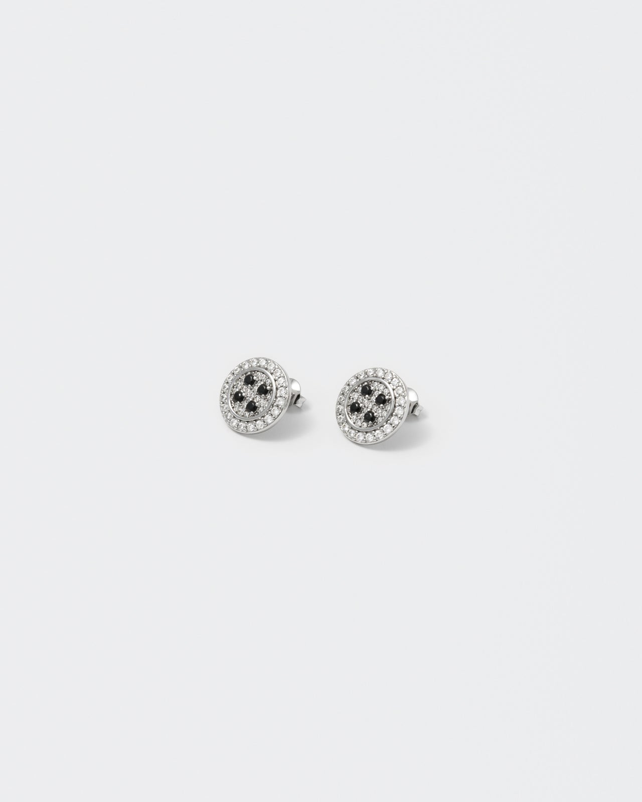 button earrings with 18kt white gold coating and hand-set micropavé in diamond white and black stones. 925 silver pin, metal realistic details and logo engraved on the back