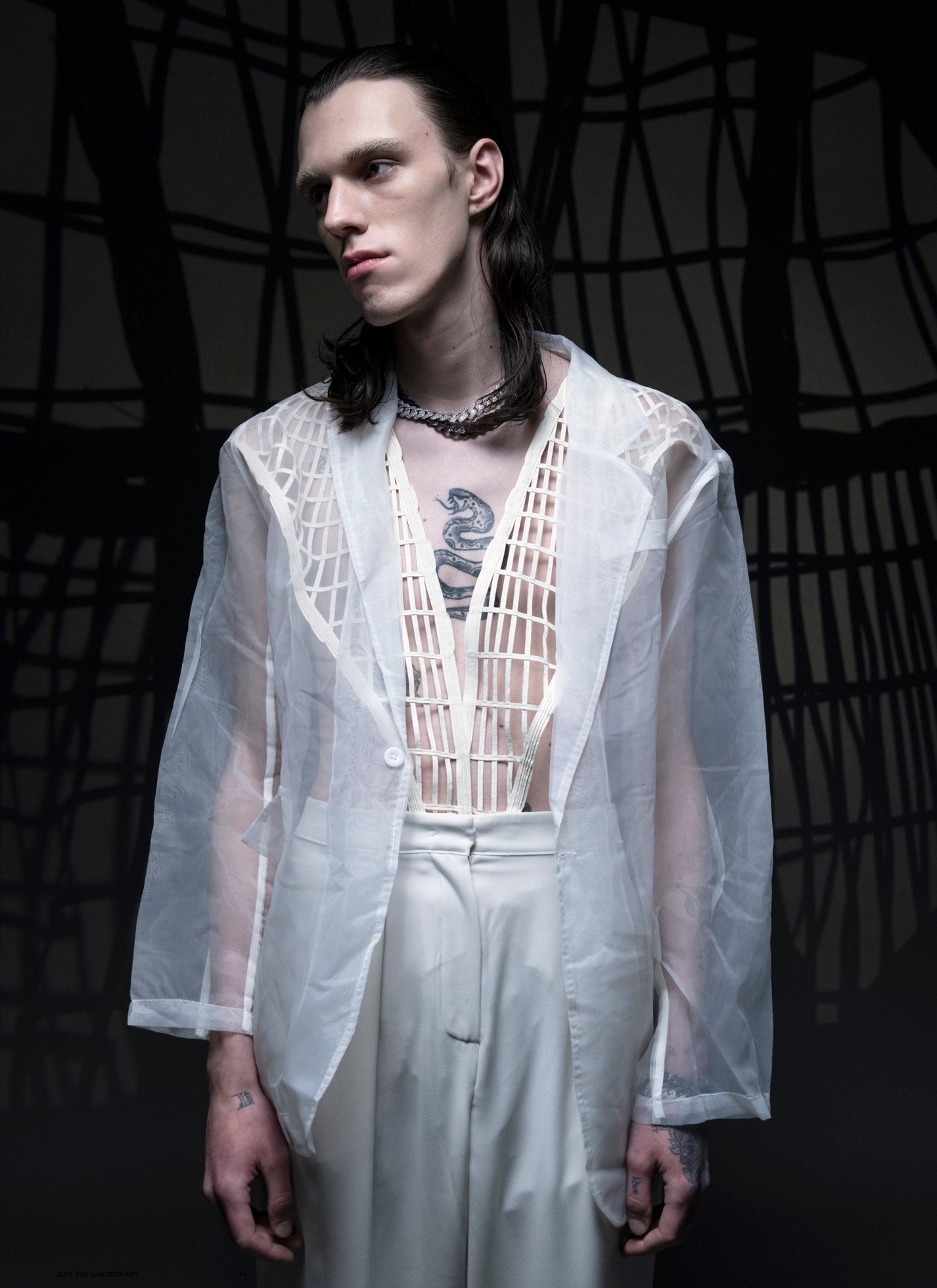 DARKAI Outer World Lookbook SS23 Man wearing prong chain necklaces with diamonds