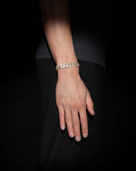 man wearing 18 carats white and yellow solid gold and silver bracelet with natural diamonds and moissanite diamonds