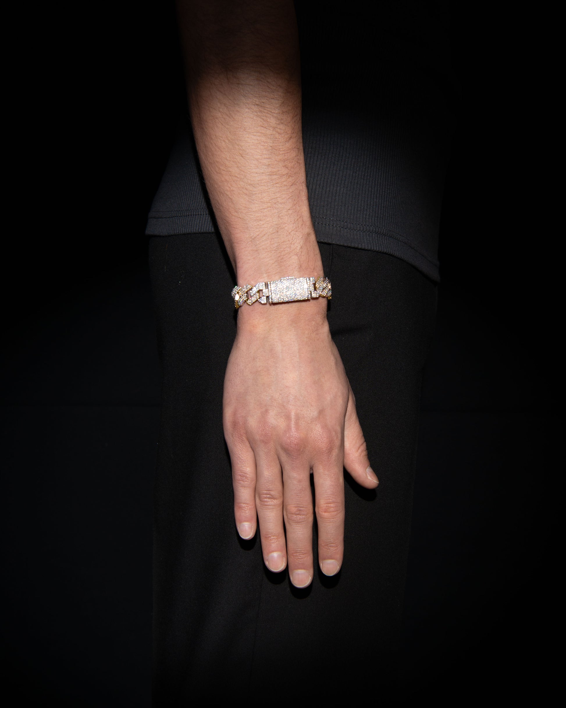 man wearing 18 carats white and yellow solid gold and silver bracelet with natural diamonds and moissanite diamonds