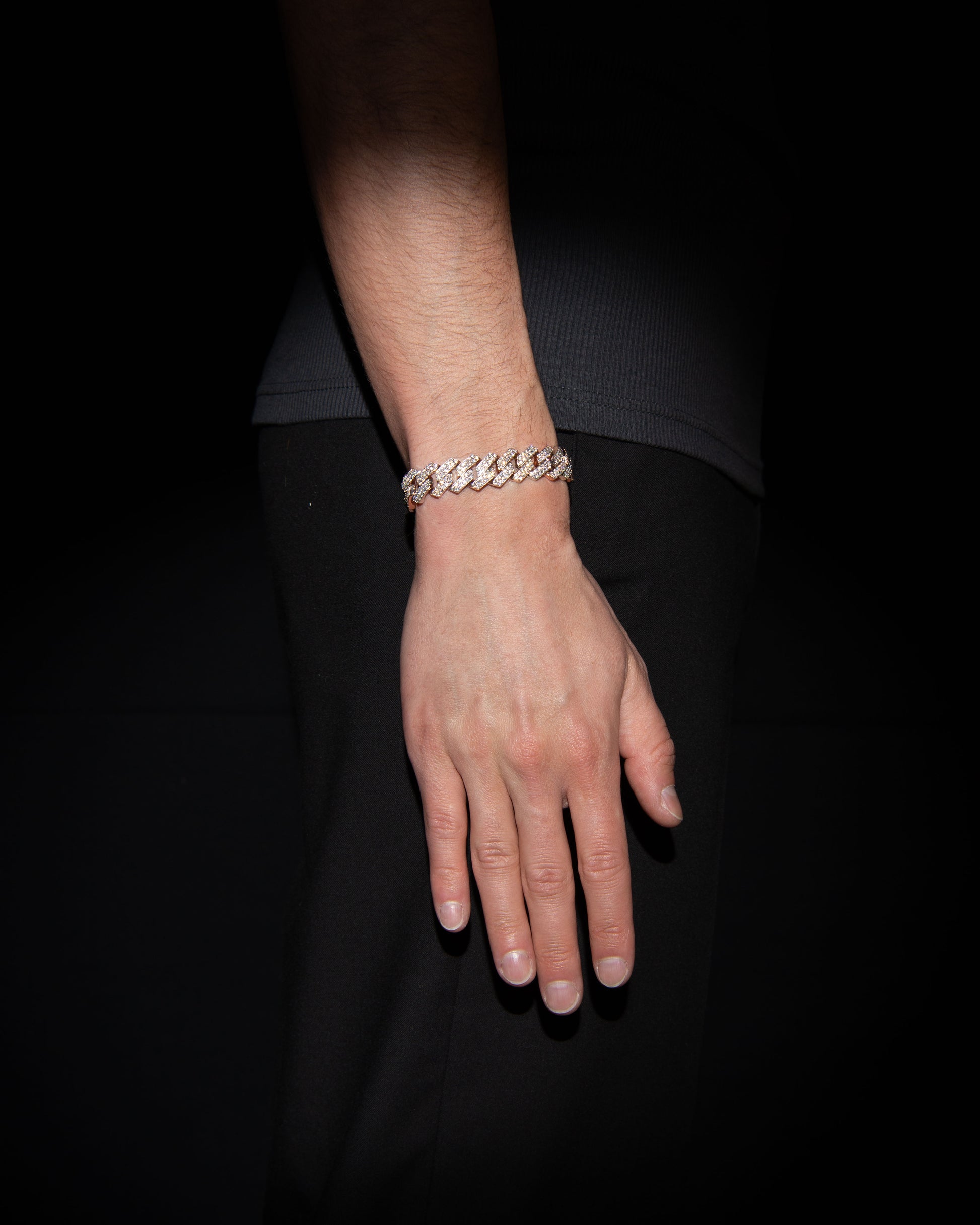 man wearing 18 carats white and rose solid gold and silver bracelet with natural diamonds and moissanite diamonds