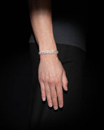 man wearing 18 carats white solid gold and silver bracelet with natural diamonds and moissanite diamonds
