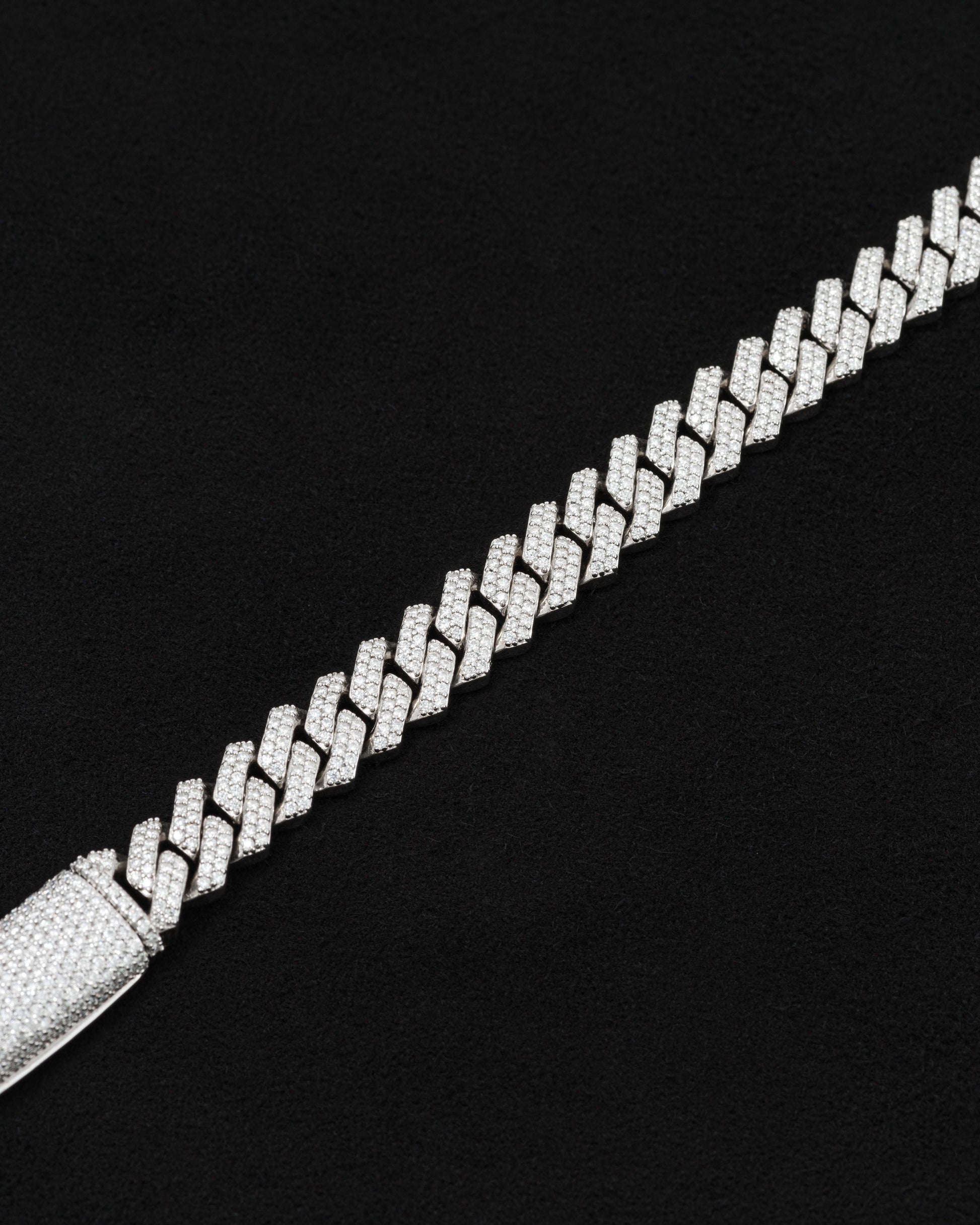 detail of 18 carats white solid gold and silver bracelet with natural diamonds and moissanite diamonds