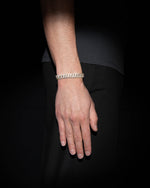 man wearing 18 carats yellow solid gold and silver bracelet with natural diamonds and moissanite diamonds