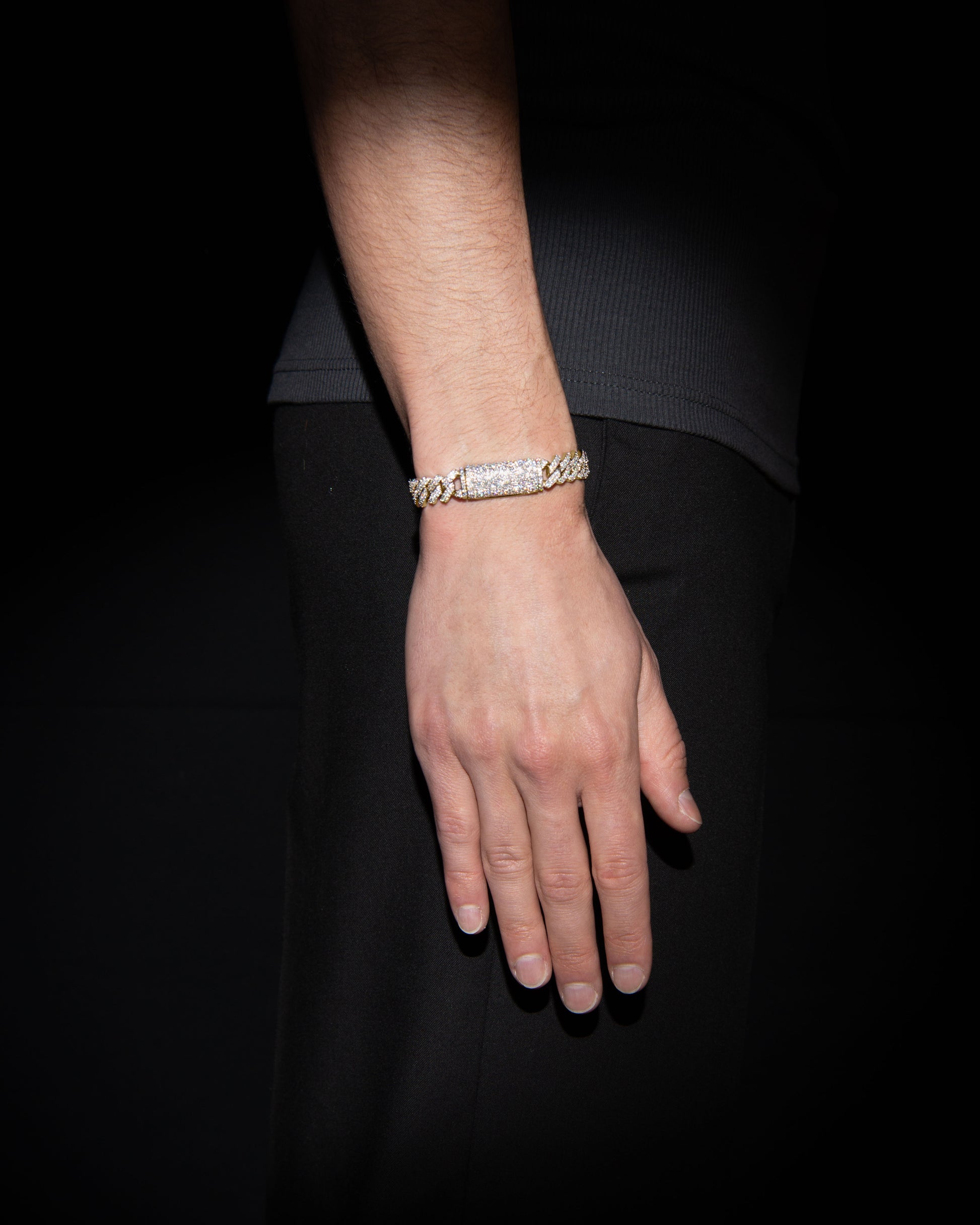 man wearing 18 carats yellow solid gold and silver bracelet with natural diamonds and moissanite diamonds