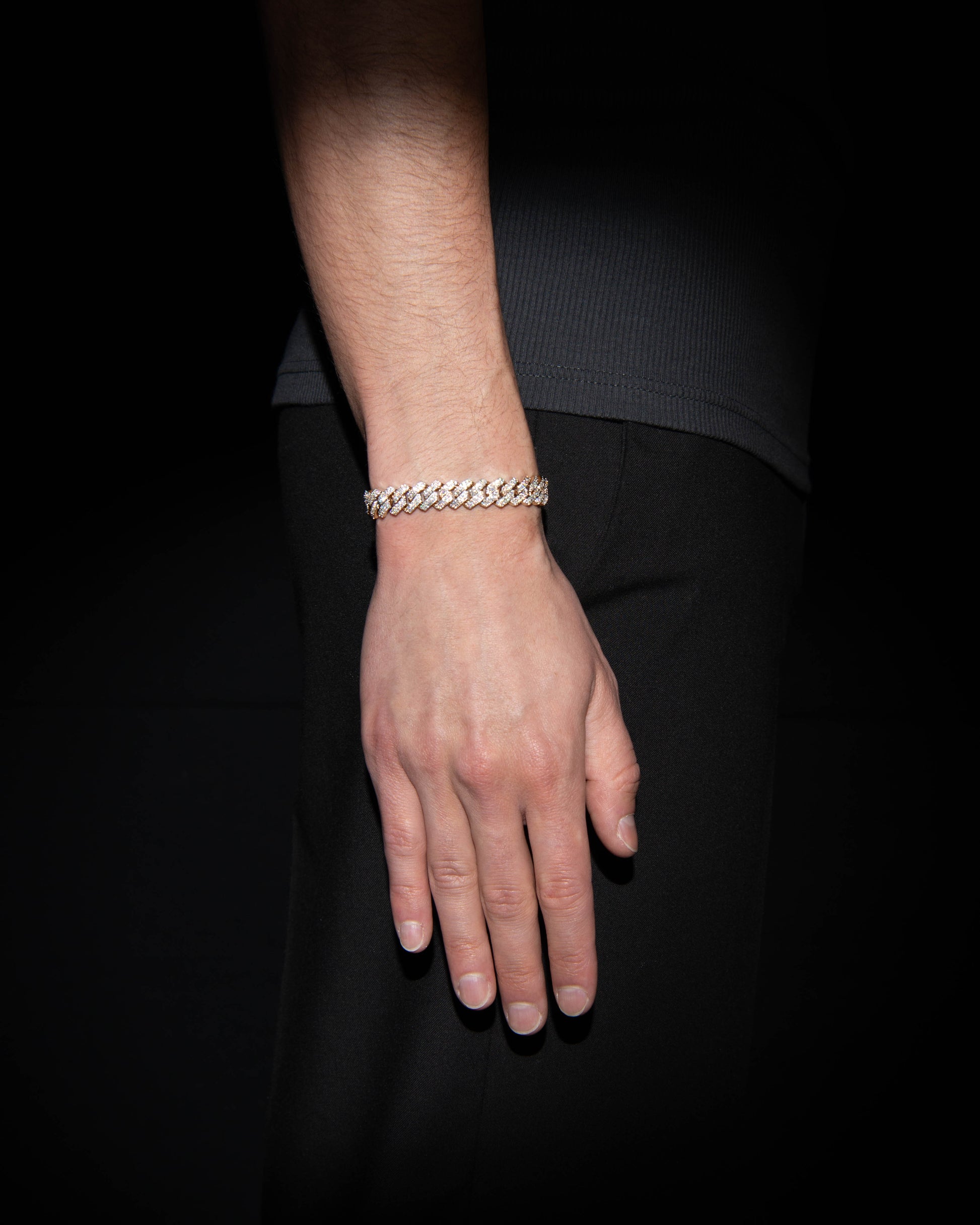 man wearing 18 carats rose solid gold and silver bracelet with natural diamonds and moissanite diamonds