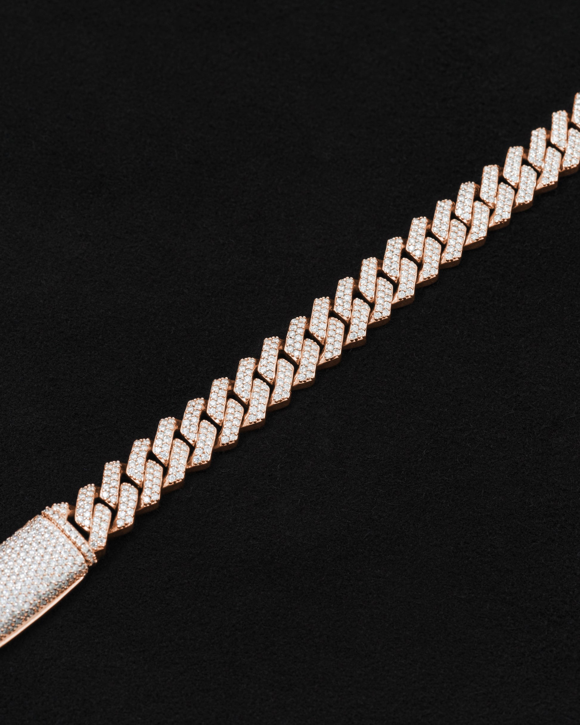 detail of 18 carats rose solid gold and silver bracelet with natural diamonds and moissanite diamonds