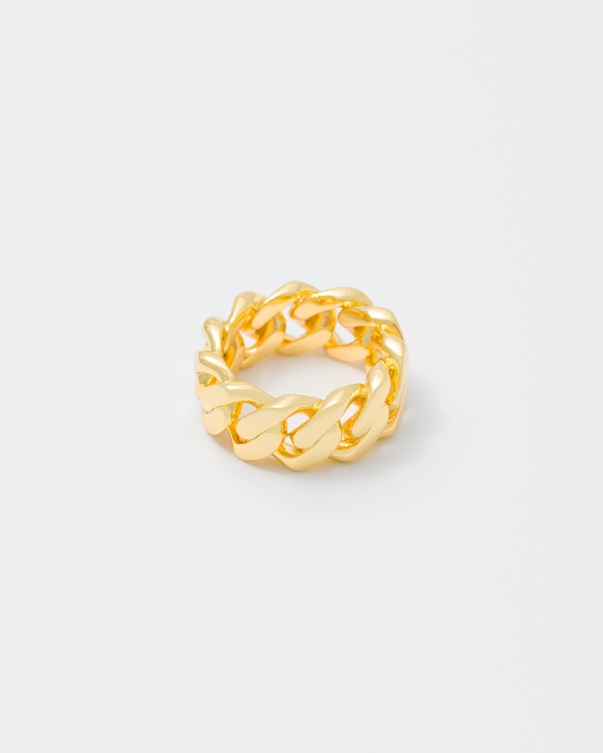 detail of gold cuban ring for man end woman 