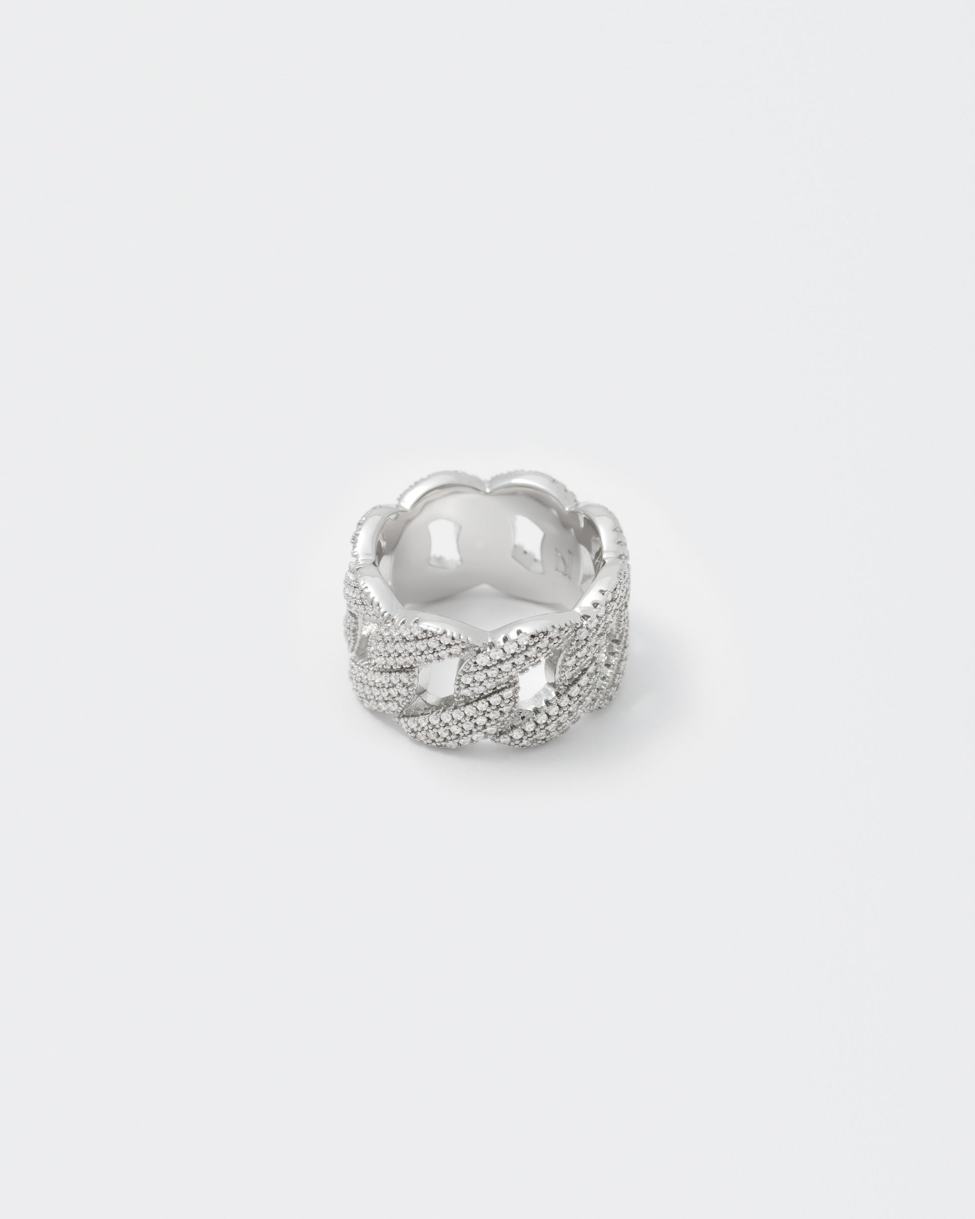 detail of white cuban ring white stones for man end woman 