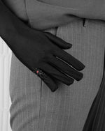 man with black suit and grey pants wearing stainless steel black widow ring with stores