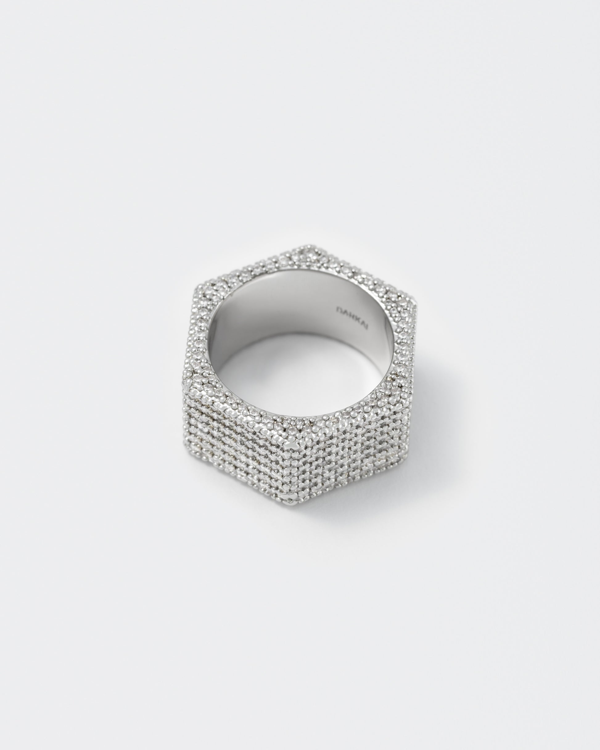 detail of bolt ring with 18kt white gold coating and 360° degrees hand-set micropavé stones in diamond white with highly polished inner ring and logo engraved