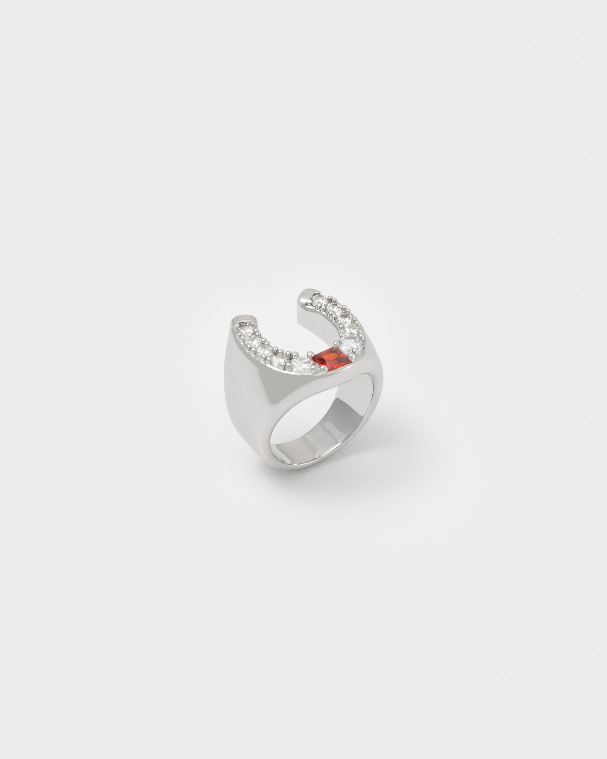 horseshoe ring with 18kt white gold coating and round shaped brilliant-cut diamond white stones with central princess-cut garnet stone