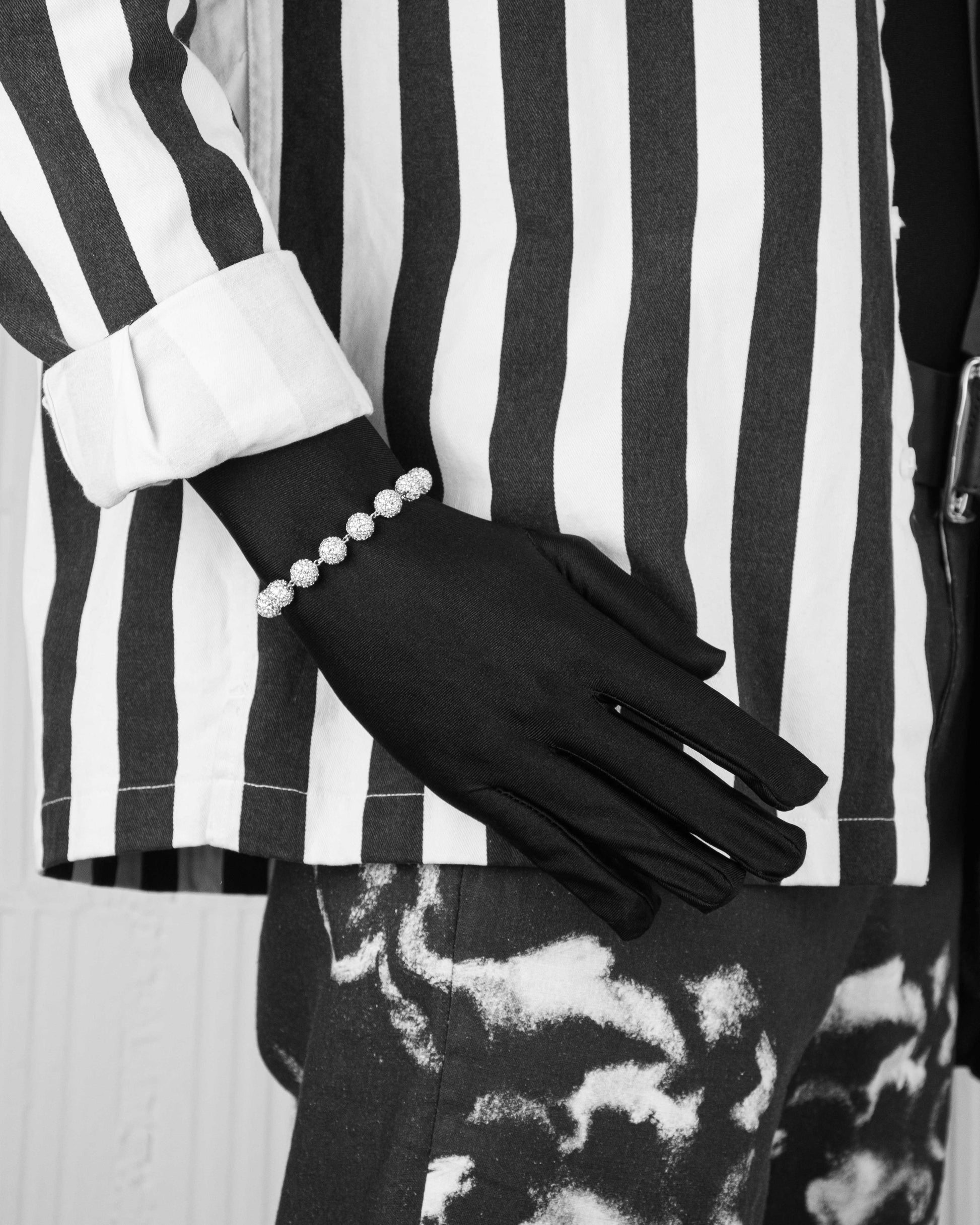 man with black suit wearing spheres bracelet with hand-set micropavé stones