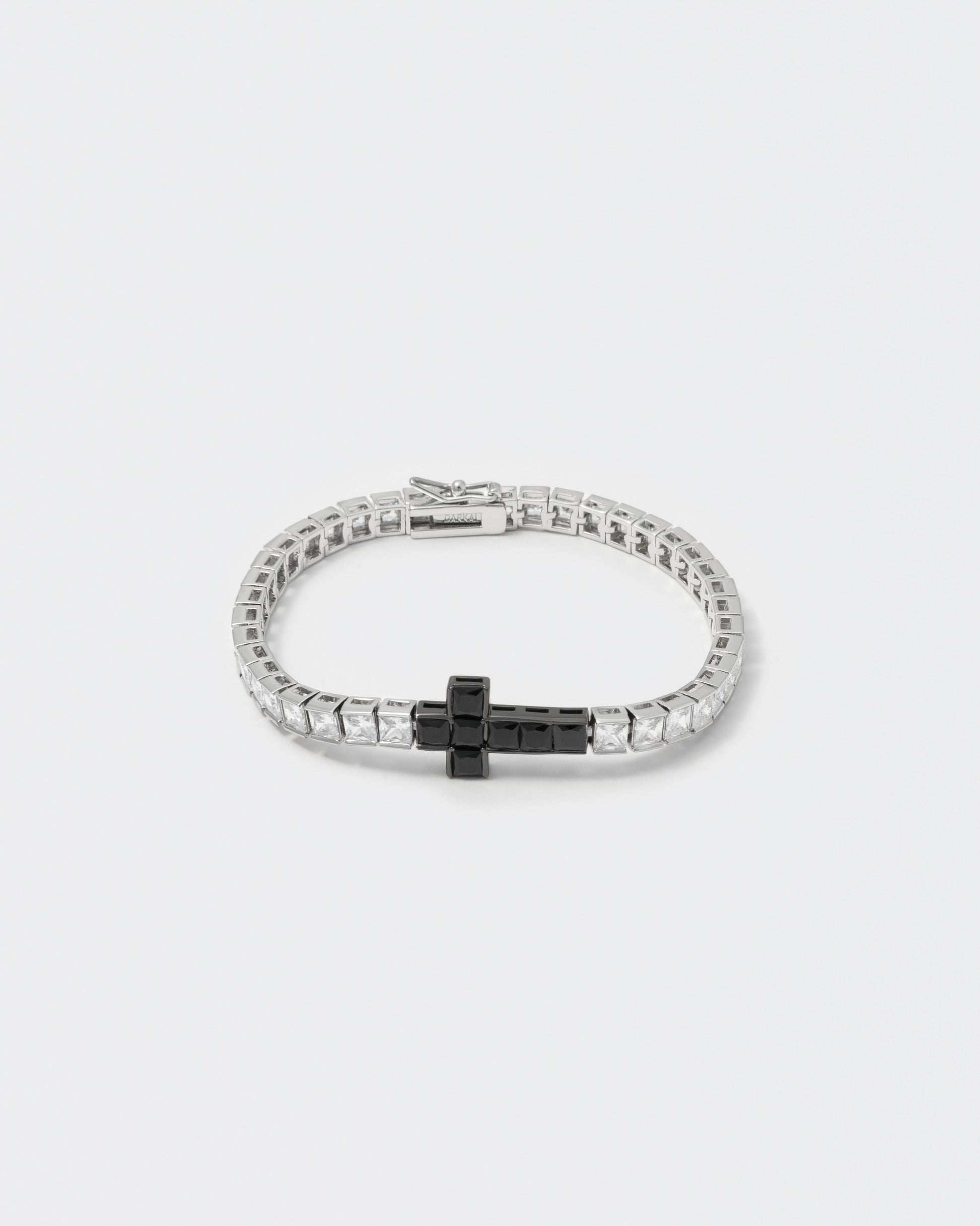 18k white gold and black coated tennis chain bracelet with contrasting cross element and hand-set princess-cut stones in white and black