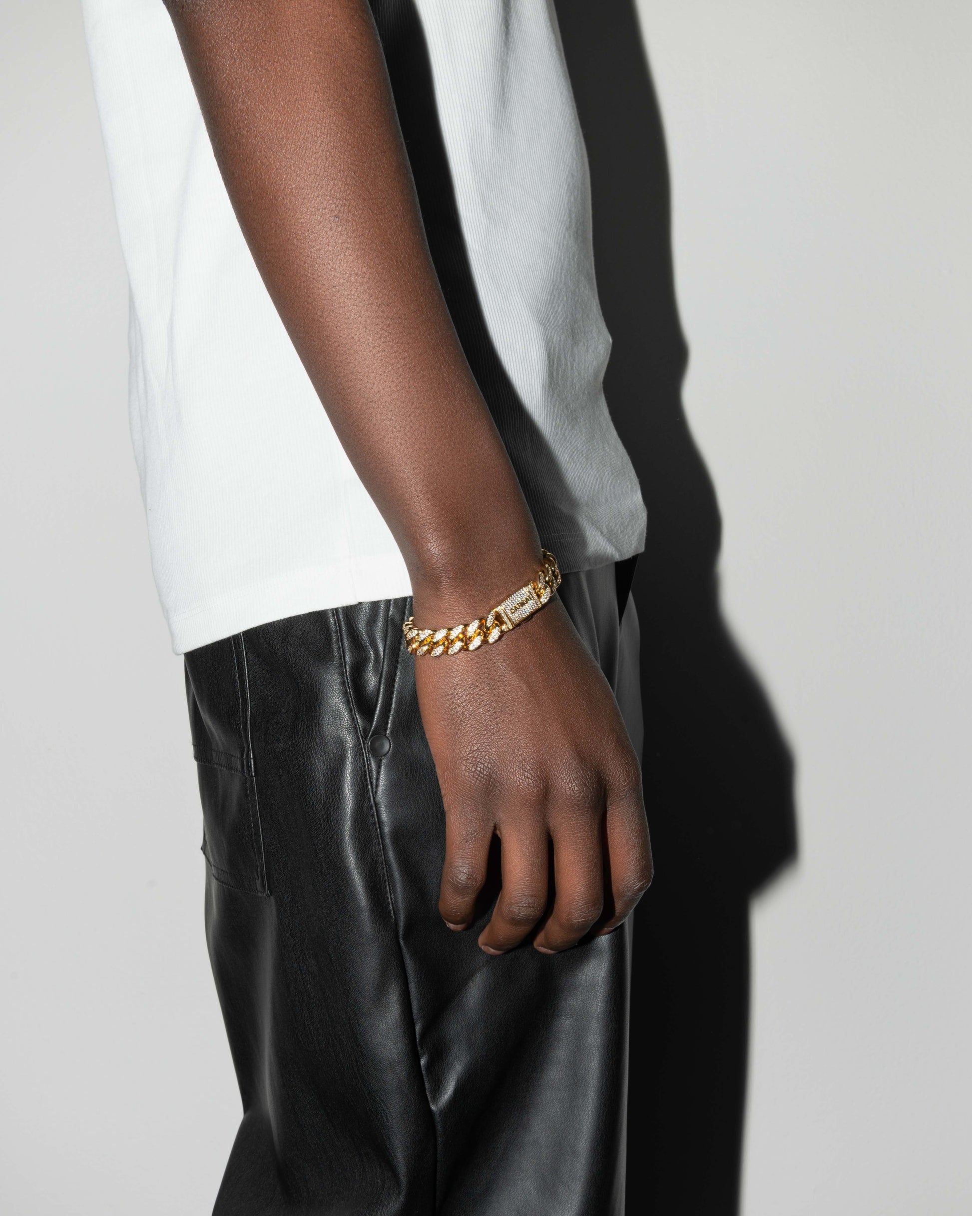 street style man wearing 18k yellow gold coated cuban chain bracelet with hand-set micropavé stones in white