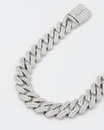 detail of 18k white gold coated prong chain bracelet with hand-set micropavé stones in white