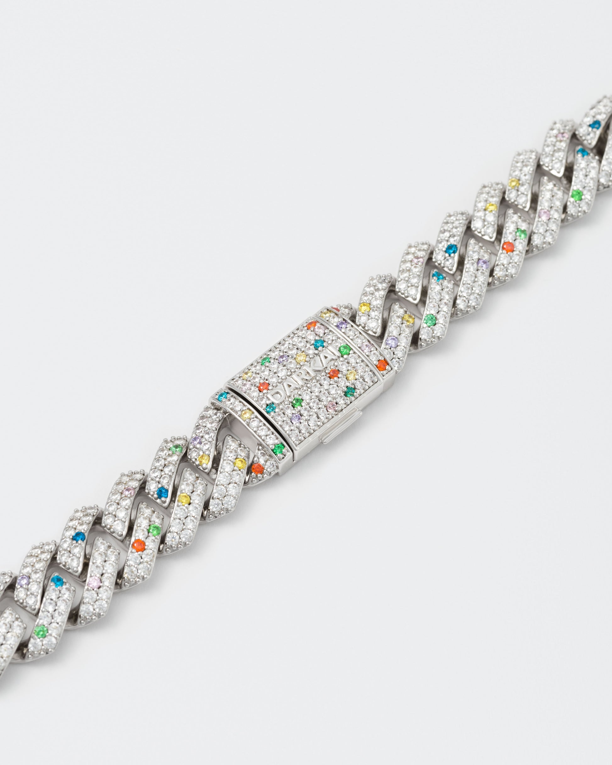 detail of the bracelet clasp with hand-set micropavé stones in white, violet, orange red, green, golden yellow and topaz blue