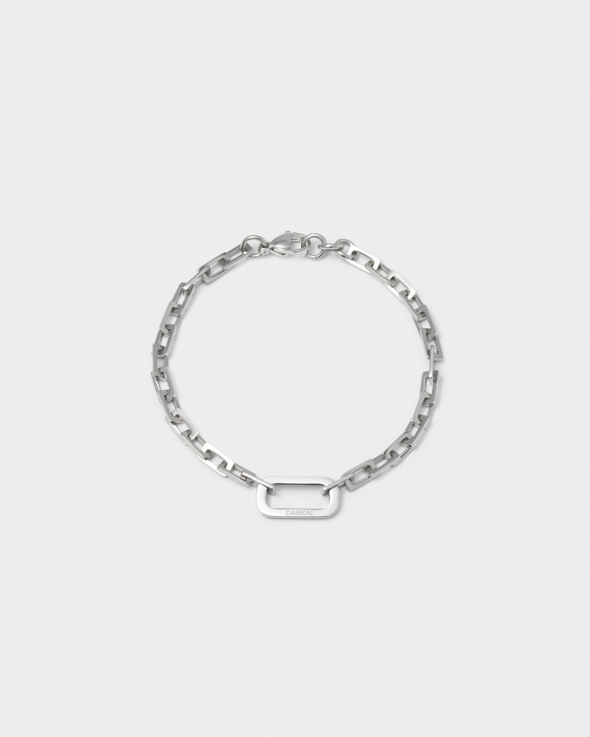 18k white gold coated edgy diamond finished rolo chain bracelet with central oval link detail and lobster clasp with logo