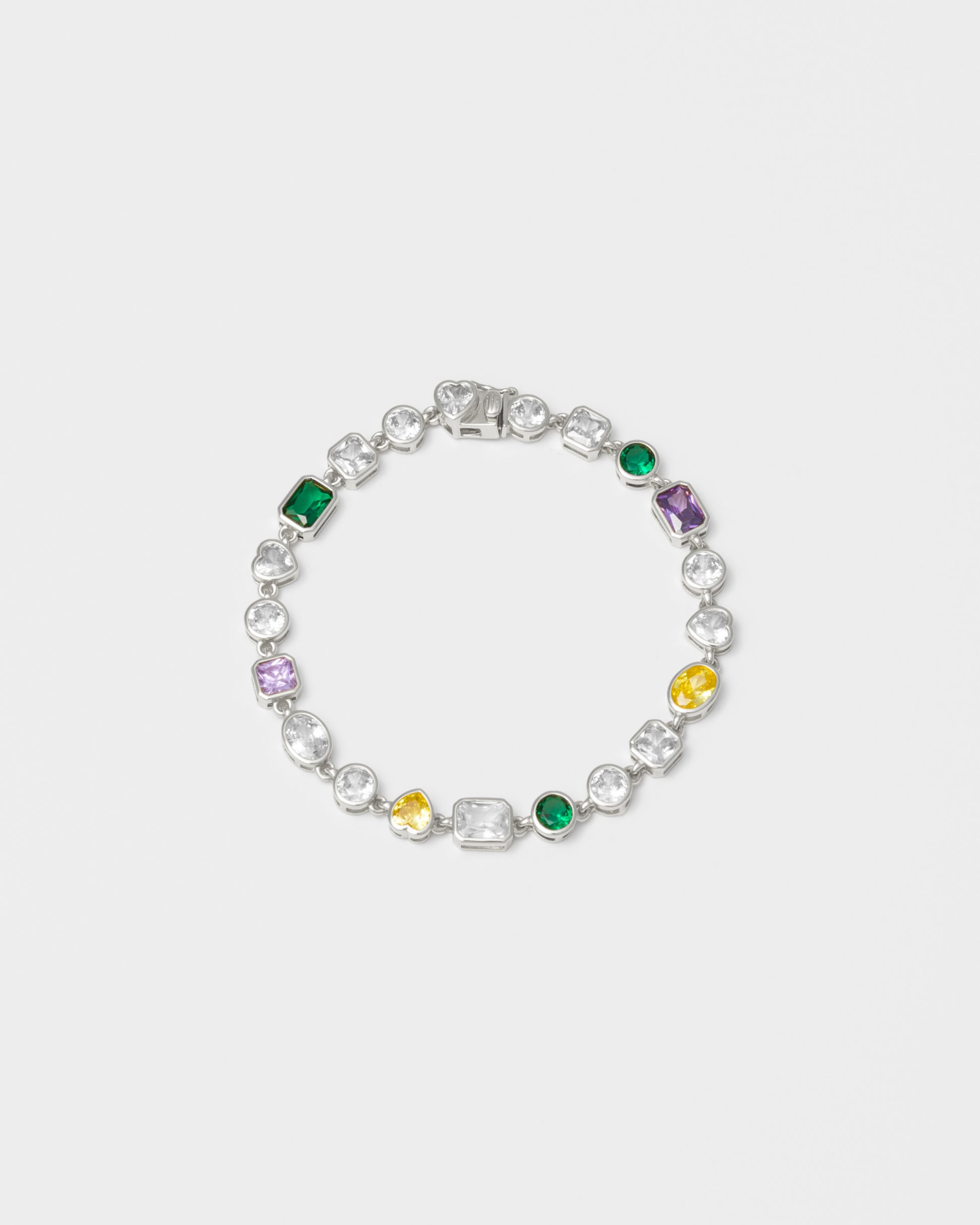 mixed bezels chain bracelet with 18kt white gold coating and hand-set stones of irregular shapes and colors. Ensemble of rectangular, square, round and heart-shaped stones in diamond white, amethyst, lilac, emerald green and gold yellow. Invisible closure with logo.