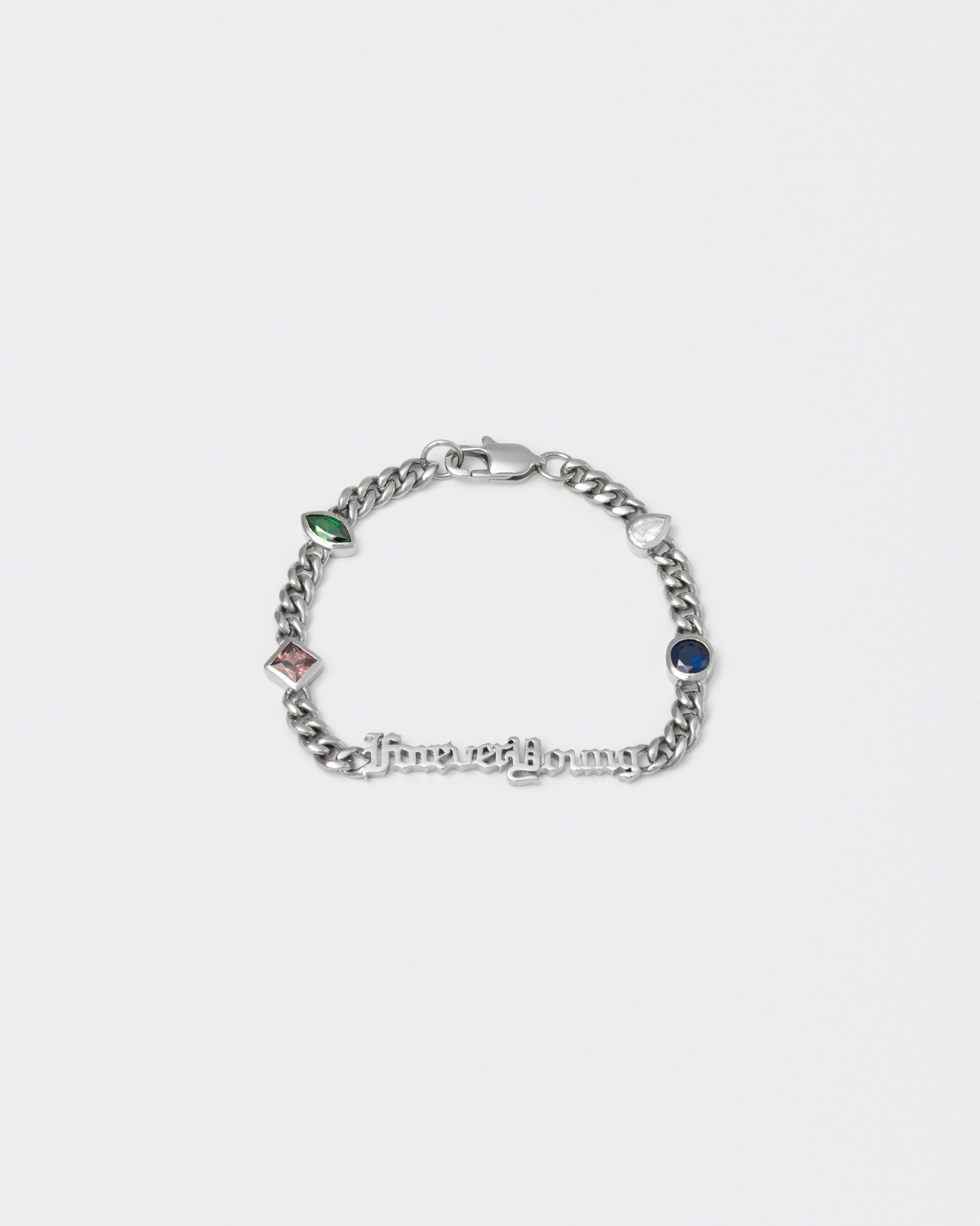 Forever Young cuban chain bracelet with 18kt white gold coating, mixed shape bezel stones in diamond white, burna blue, green, chocolate and "Forever Young" central metal tag