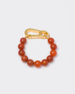 Amber stones bracelet with 18k yellow gold coated lasered logo oversize carabiner clasp.