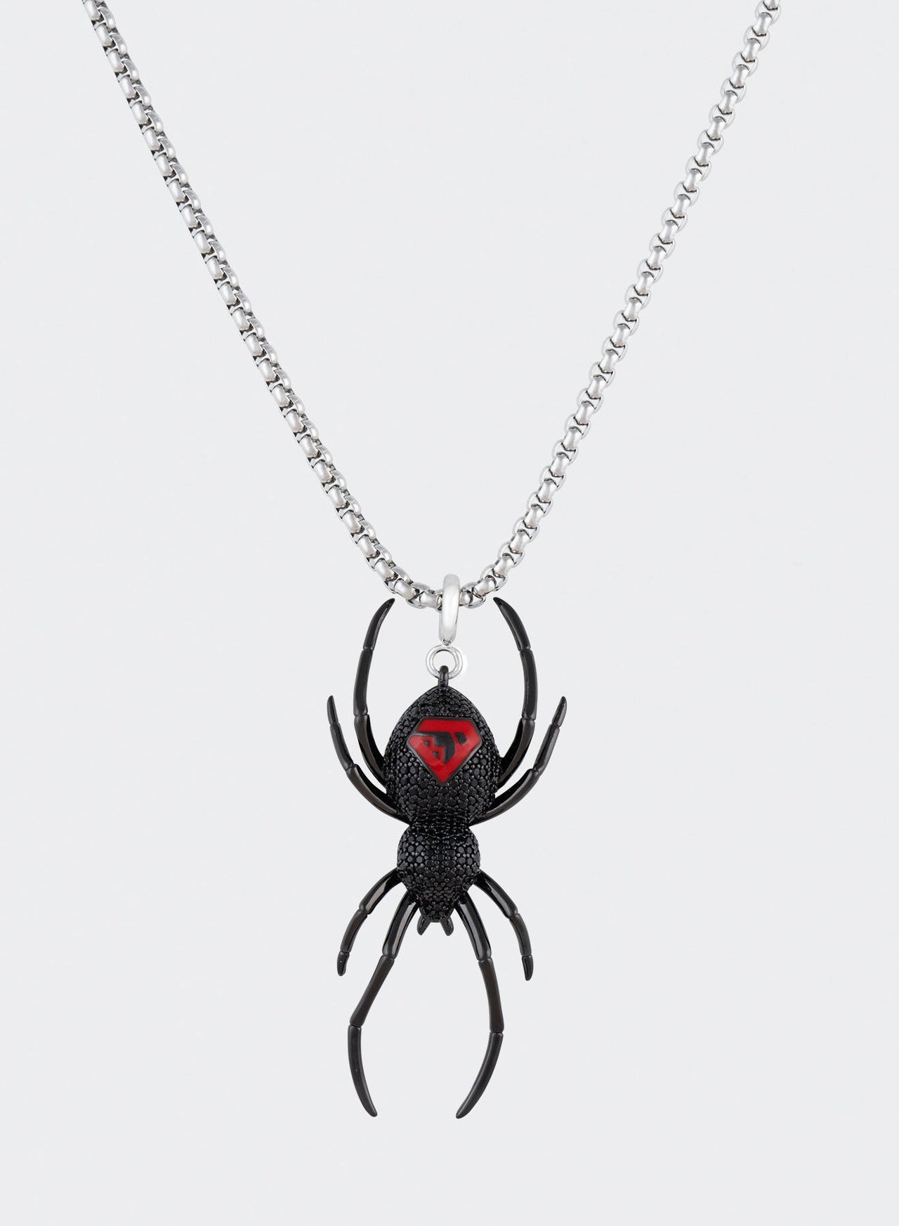 Black PVD coated black widow pendant necklace with hand-set micropavé stones in black, metal details, red enamel finishing and 3mm box chain