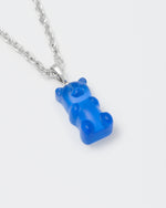 detail of 18k white gold coated gummy bear pendant necklace with 3D cut sandblasted crystal in blue and 3mm rolo chain