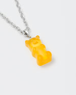 detail of 18k white gold coated gummy bear pendant necklace with 3D cut sandblasted crystal in yellow and 3mm rolo chain