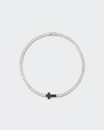 18k white gold and black coated tennis chain necklace with contrasting cross element and hand-set princess-cut stones in white and black