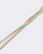detail of 18k yellow and white gold coated layers necklace with 3mm rope and cable chain and contrasting 4mm herringbone chain