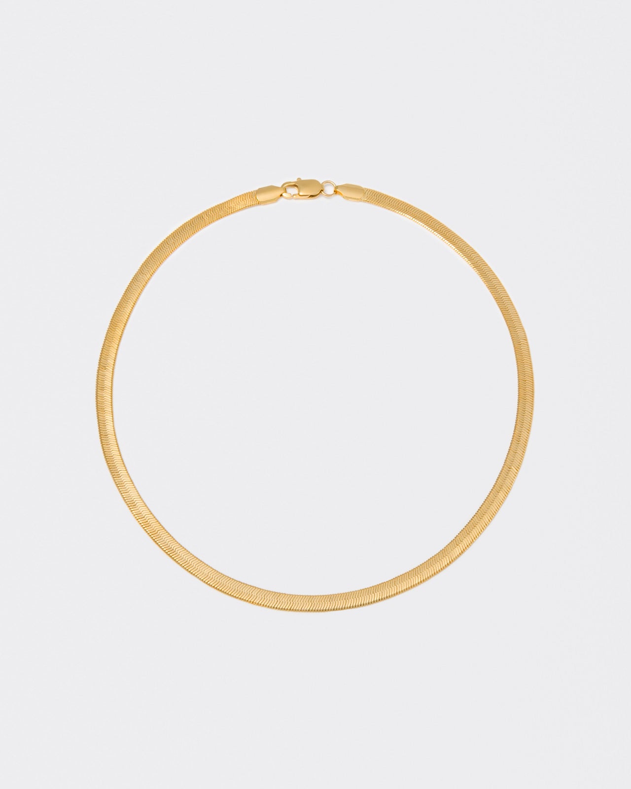 18k yellow gold coated herringbone chain necklace with lasered logo along the links and regular lobster clasp.