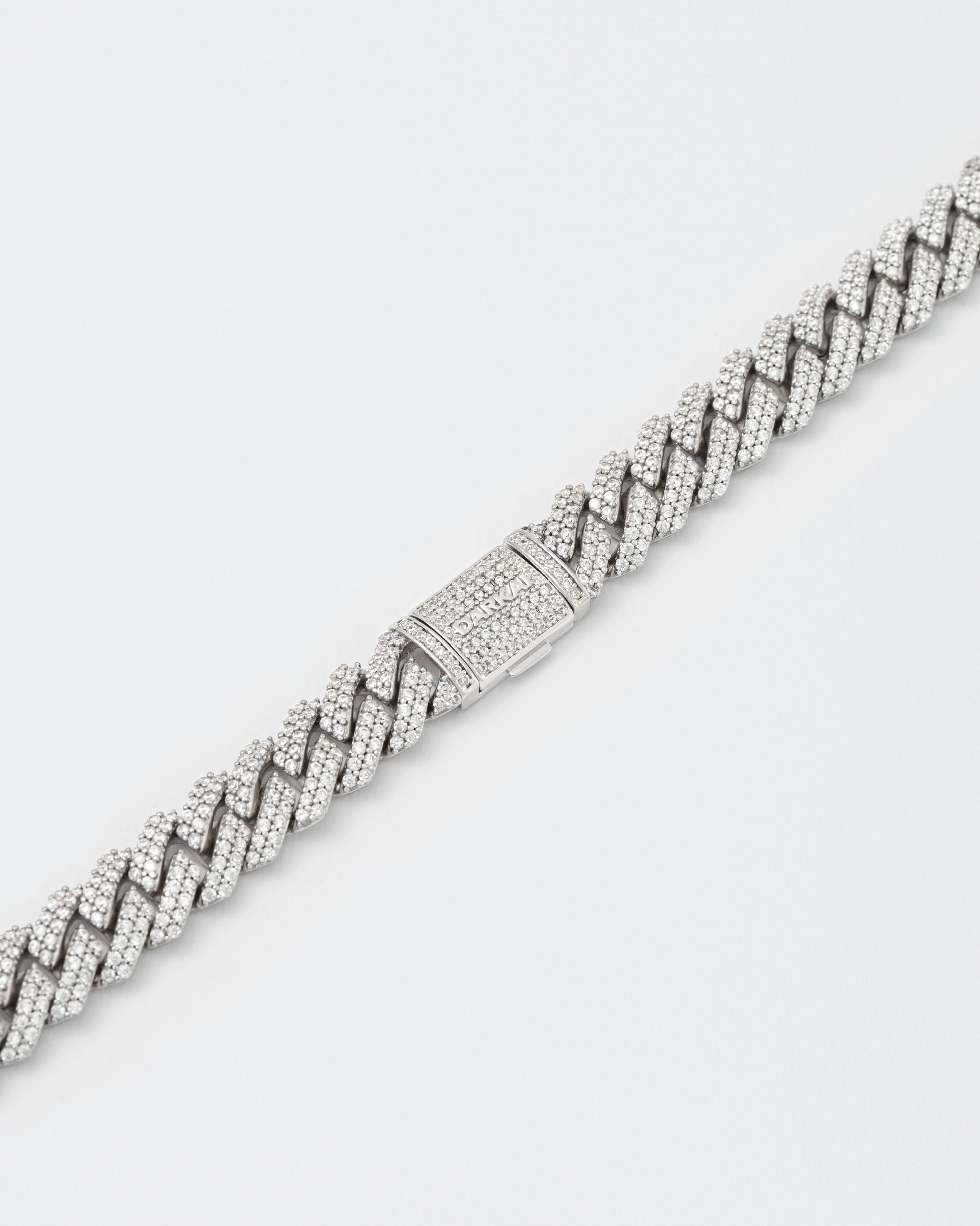 detail of clasp of 18k white gold coated mini prong chain necklace with hand-set micropavé stones in white