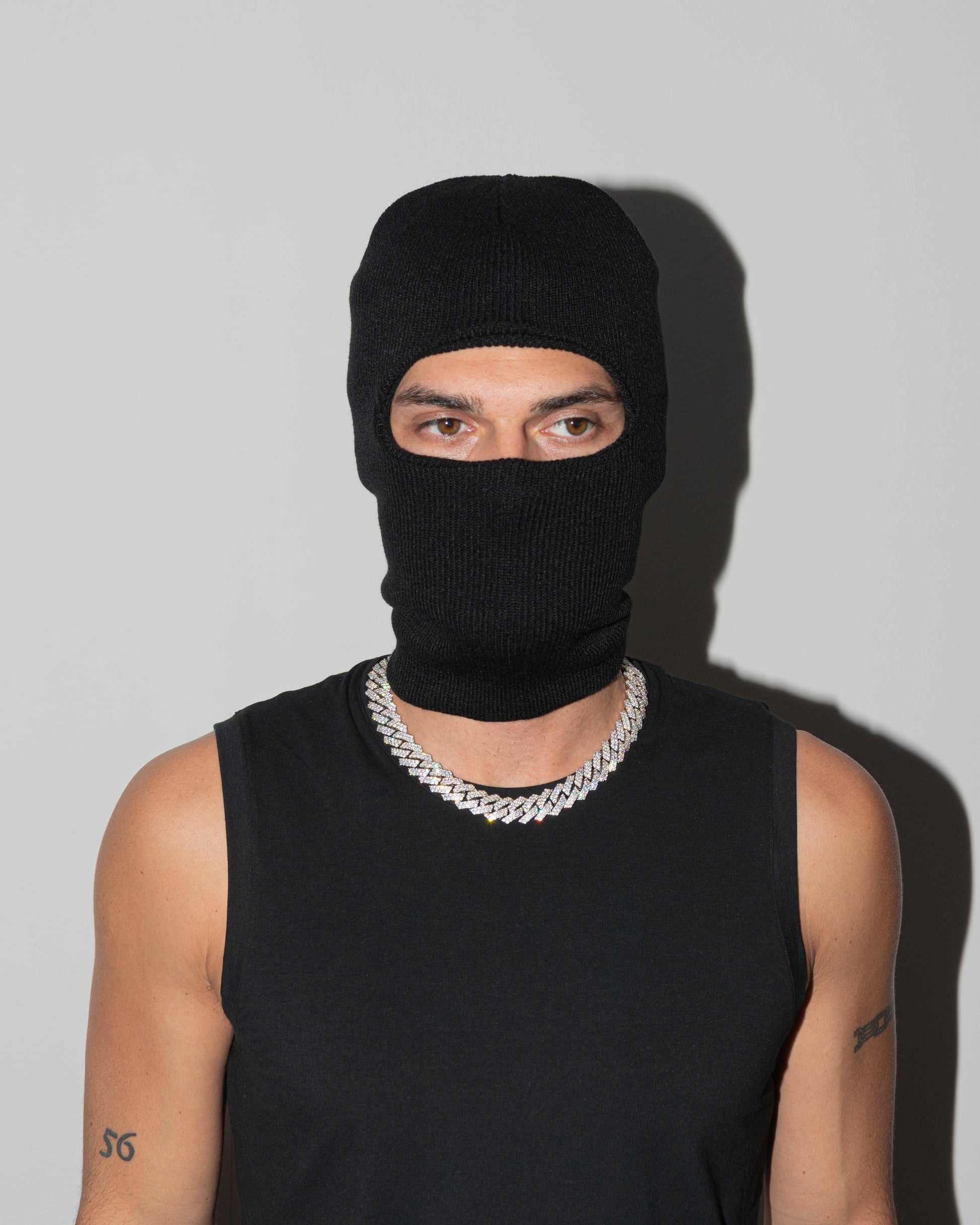 street style man wearing 18k white gold coated prong chain necklace with hand-set micropavé stones in white