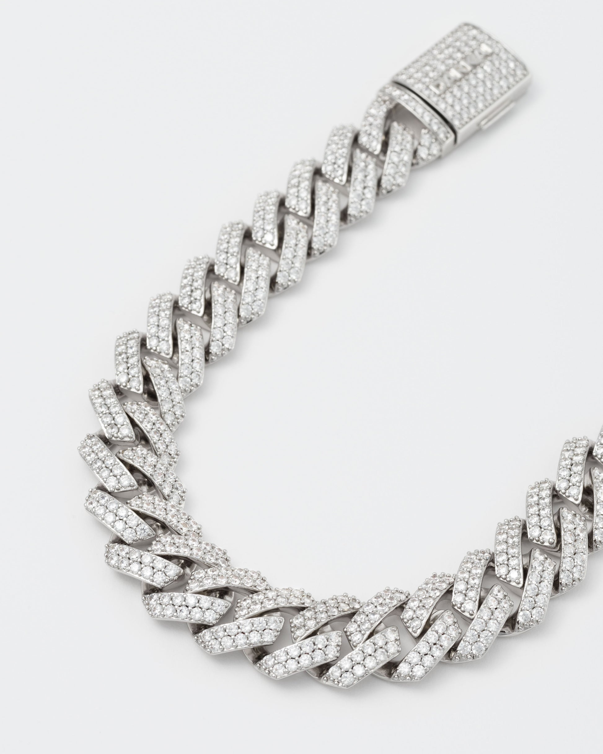 detail of 18k white gold coated prong chain necklace with hand-set micropavé stones in white