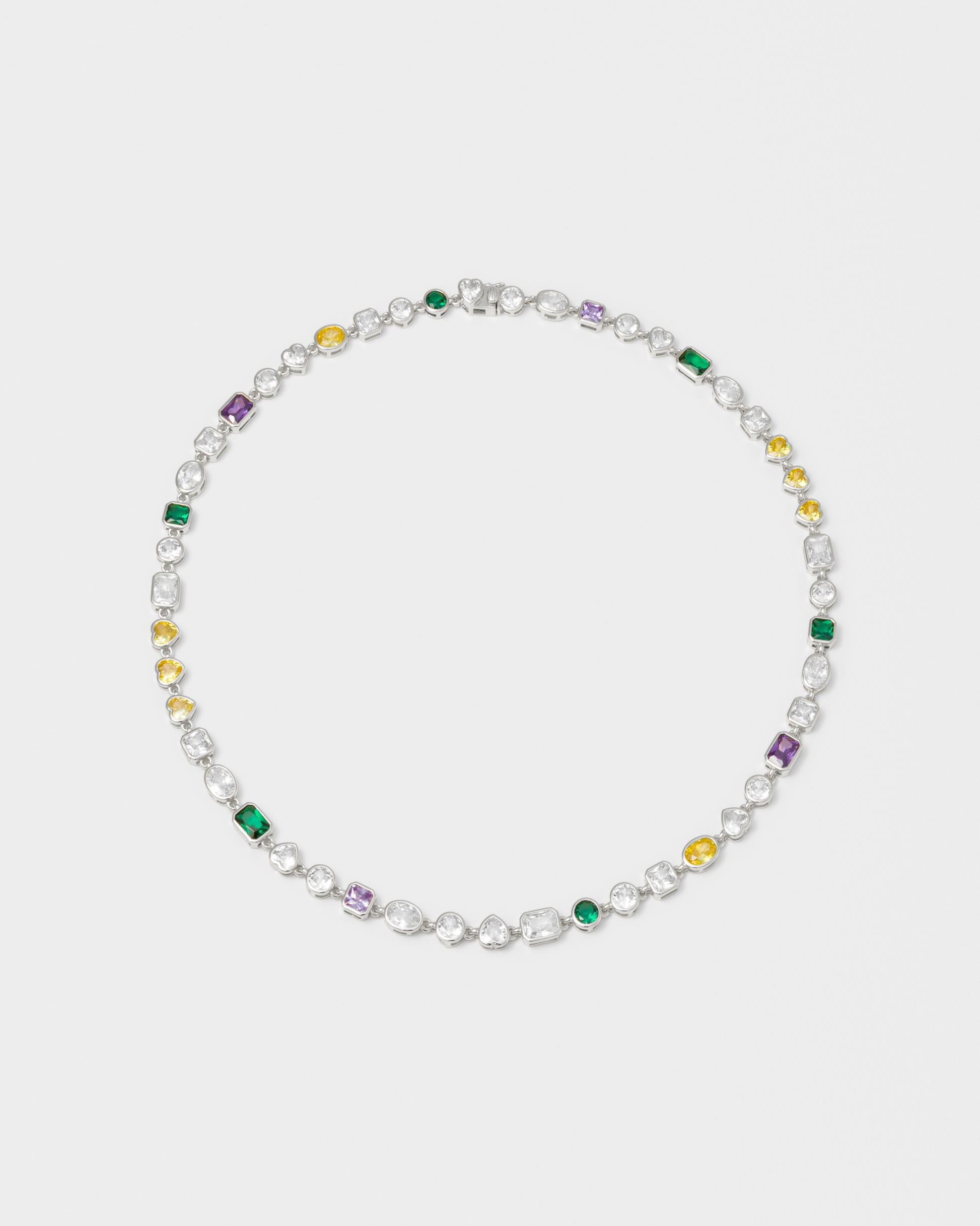 mixed bezels chain necklace with 18kt white gold coating and hand-set stones of irregular shapes and colors. Ensemble of rectangular, square, round and heart-shaped stones in diamond white, amethyst, lilac, emerald green and gold yellow. Invisible closure with logo.