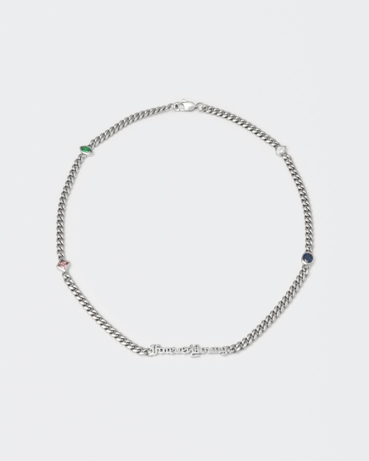 Forever Young cuban chain necklace with 18kt white gold coating, mixed shape bezel stones in diamond white, burna blue, green, chocolate and "Forever Young" central metal tag