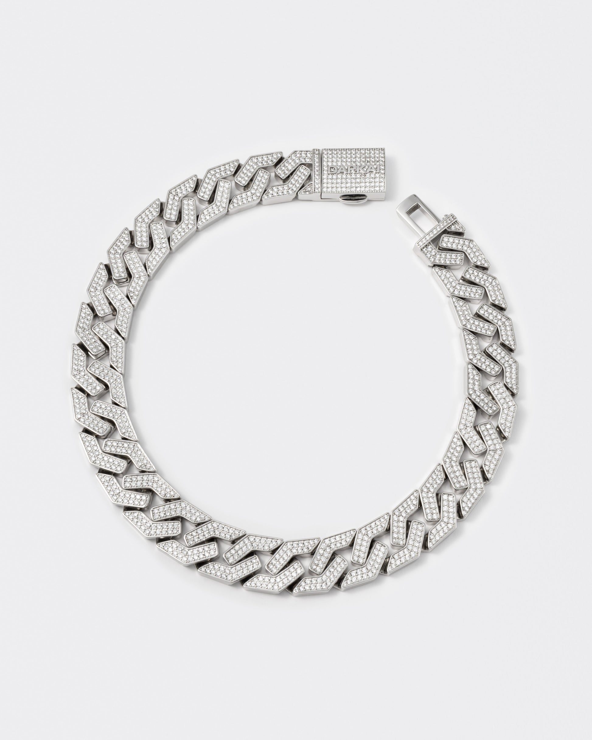 oversize prong chain necklace with 18kt white gold coating and hand-set micropavé stones in diamond white. Fine jewelry grade drawer closure with logo