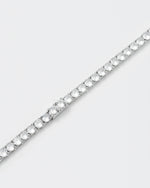 detail of tennis necklace with 18kt white gold coating and hand-set round brilliant-cut stones in diamond white