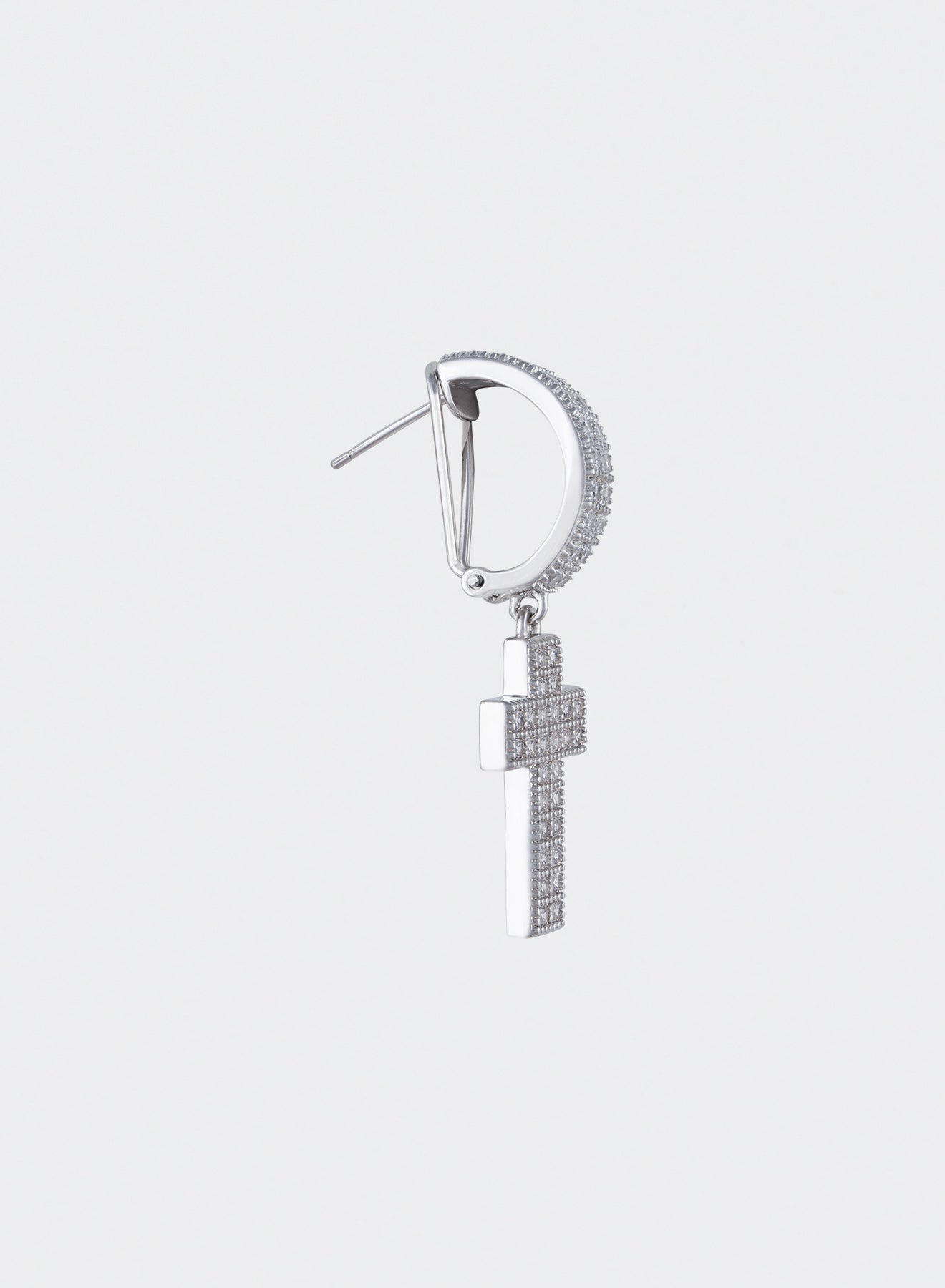 detail of 18k white gold coated cross mono earring with oversize hoop and hand-set micropavé stones in white