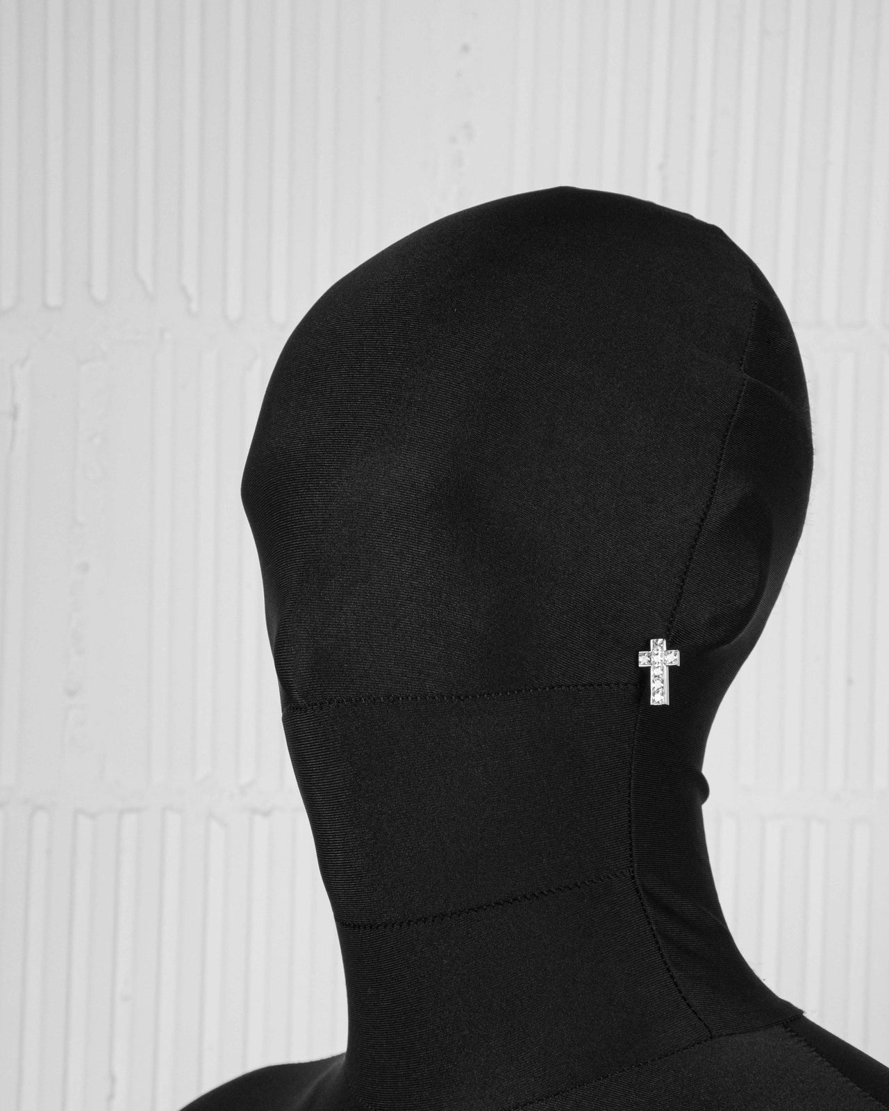 18k white gold coated asymmetrical cross tennis earrings with hand-set princess-cut stones in white