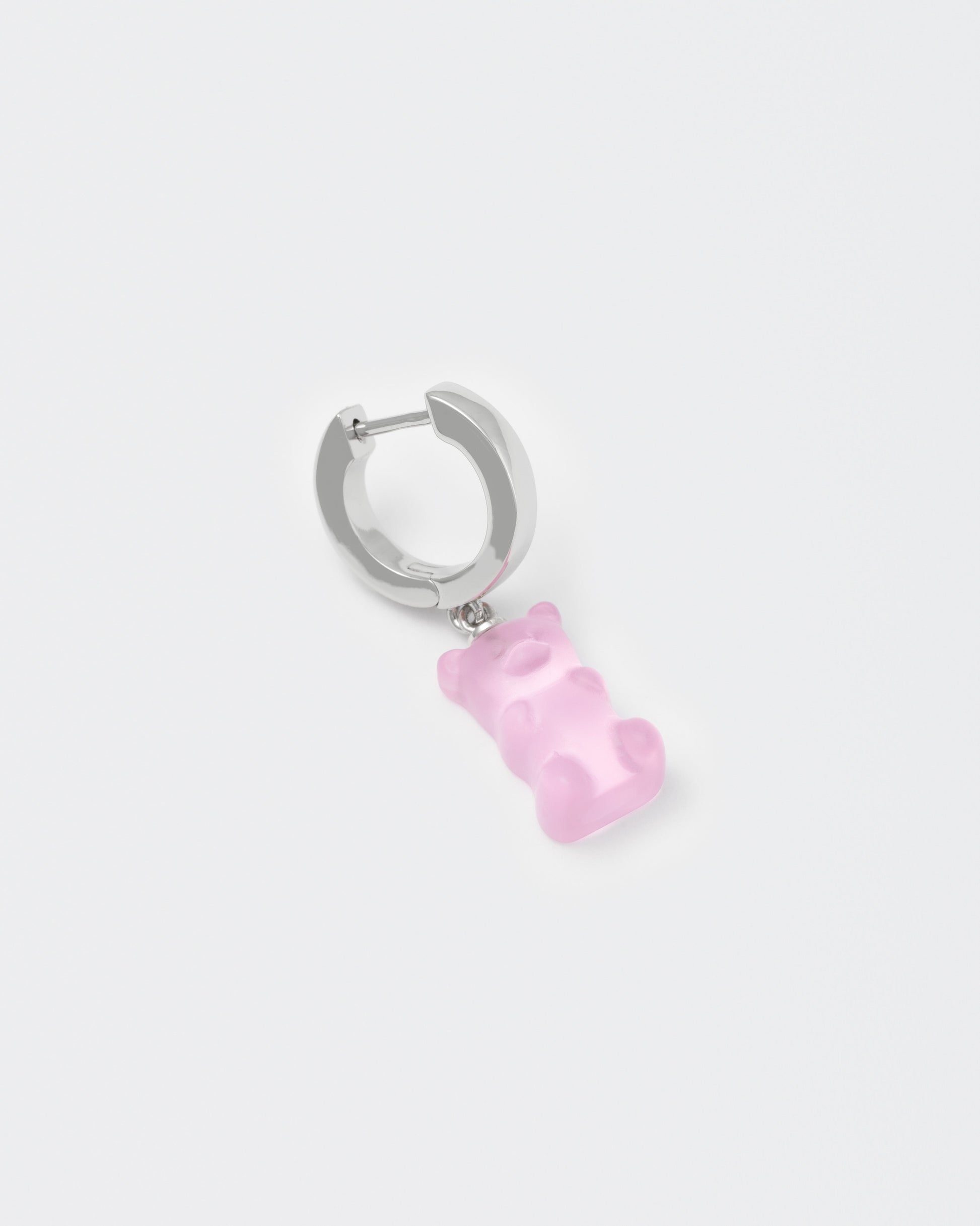 detail of 18k white gold coated gummy bear mono earring with 3D cut sandblasted crystal in pink