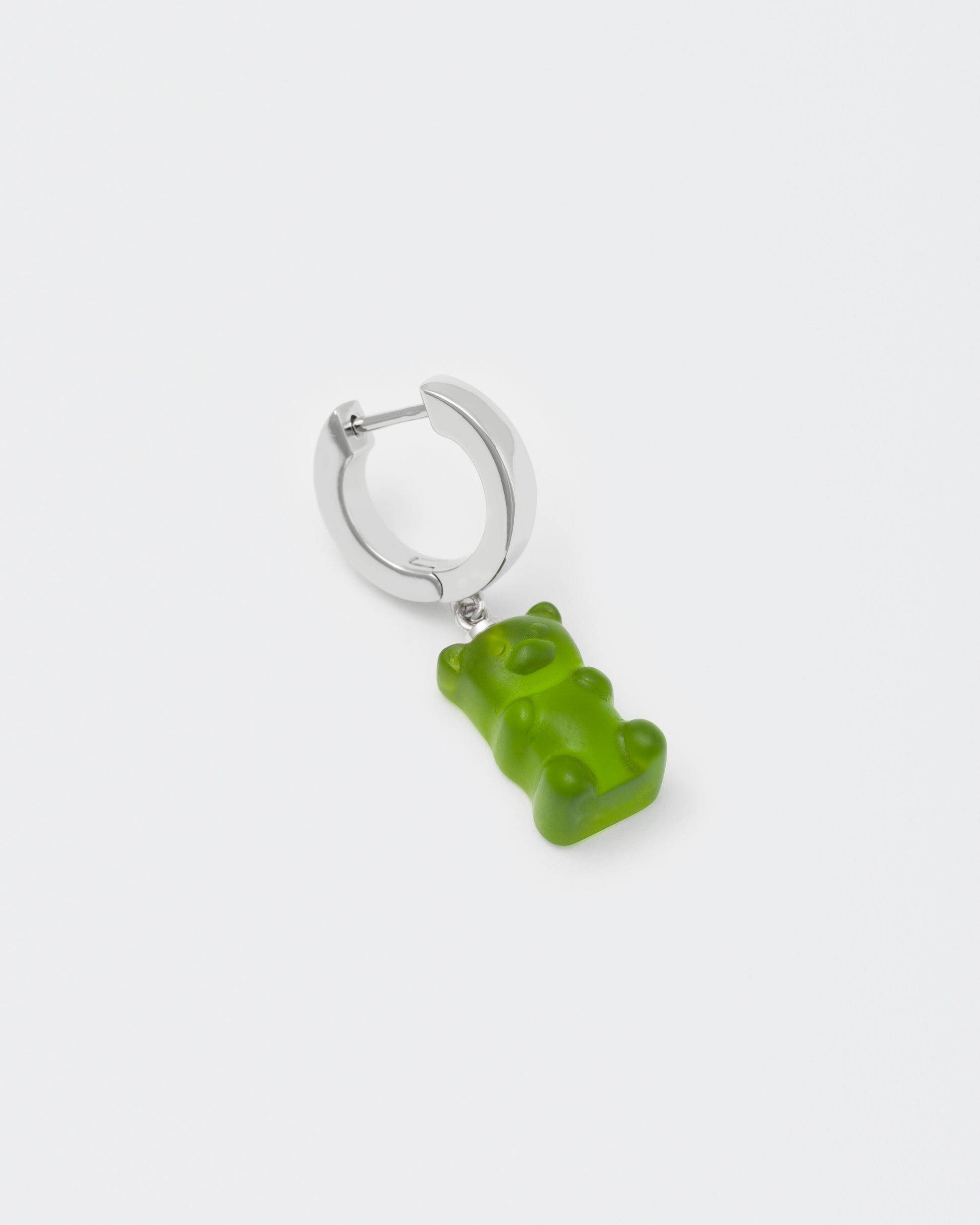 detail of 18k white gold coated gummy bear mono earring with 3D cut sandblasted crystal in green