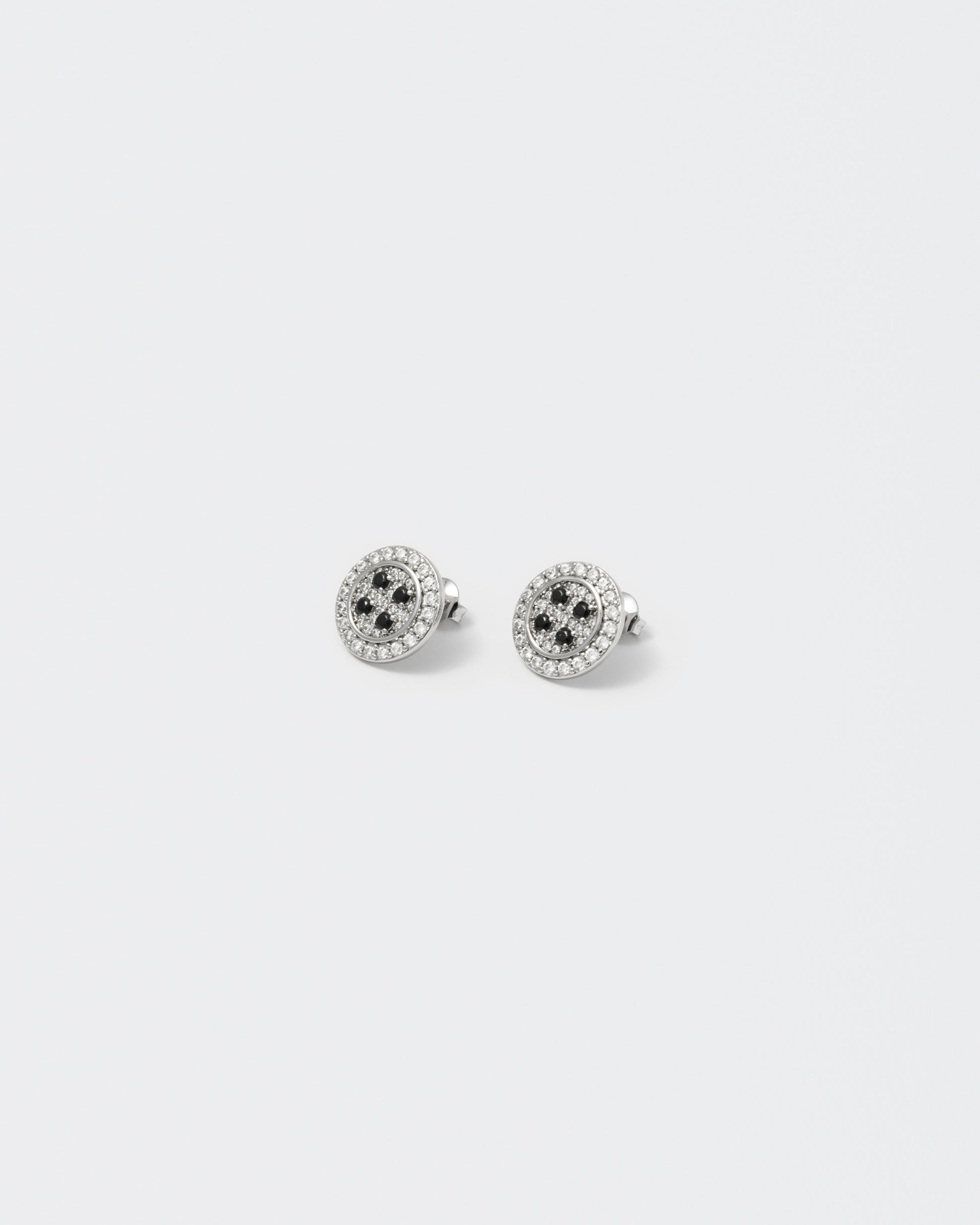 button earrings with 18kt white gold coating and hand-set micropavé in diamond white and black stones. 925 silver pin, metal realistic details and logo engraved on the back