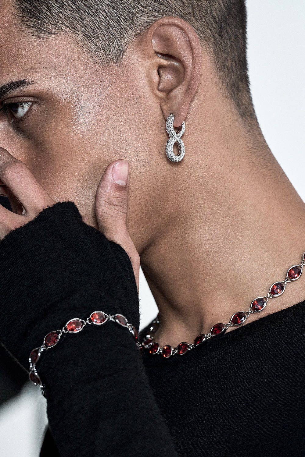 DARKAI Spiked Infinity Earrings on Male Model